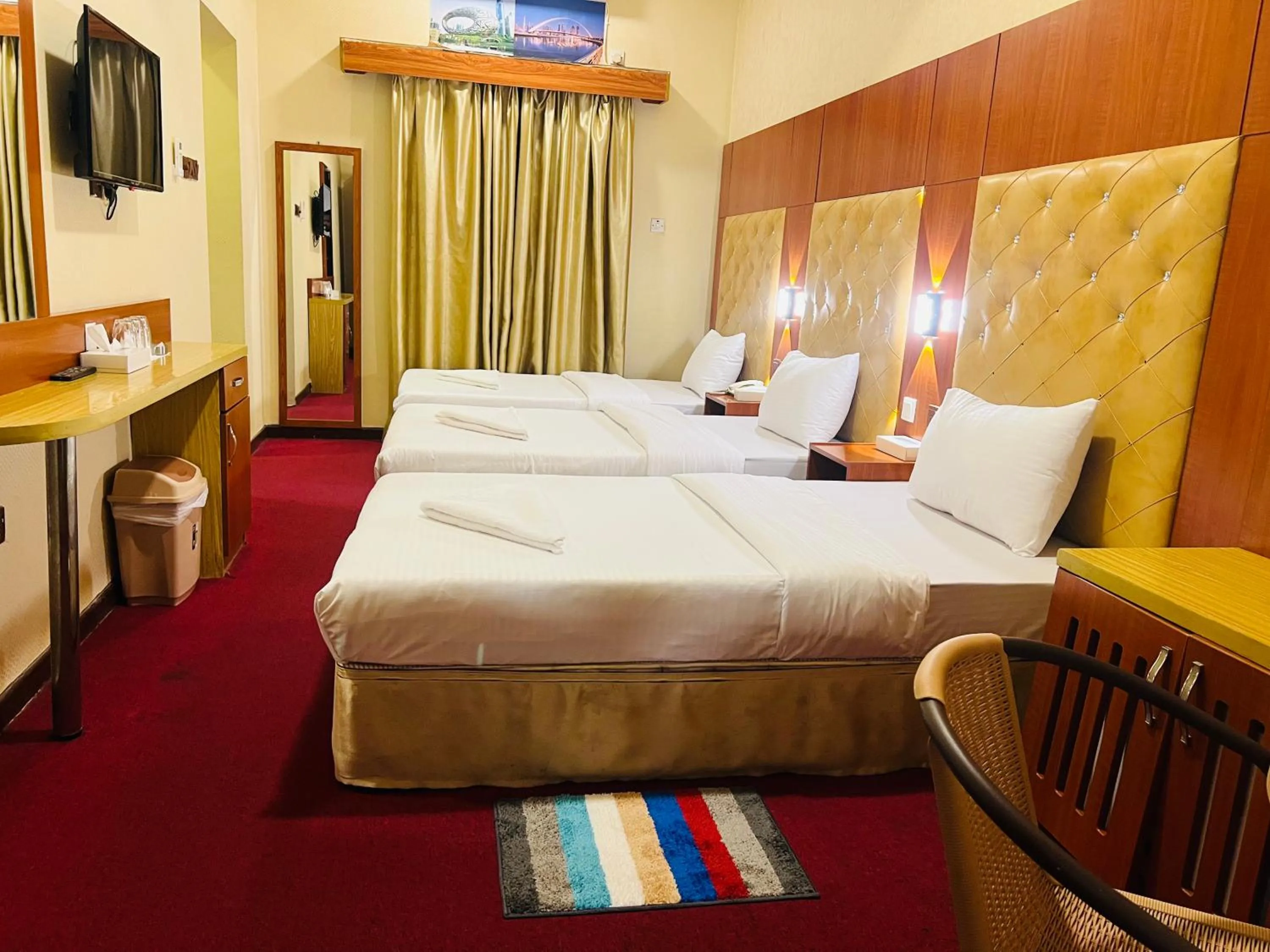 Bed in Parasol Hotel