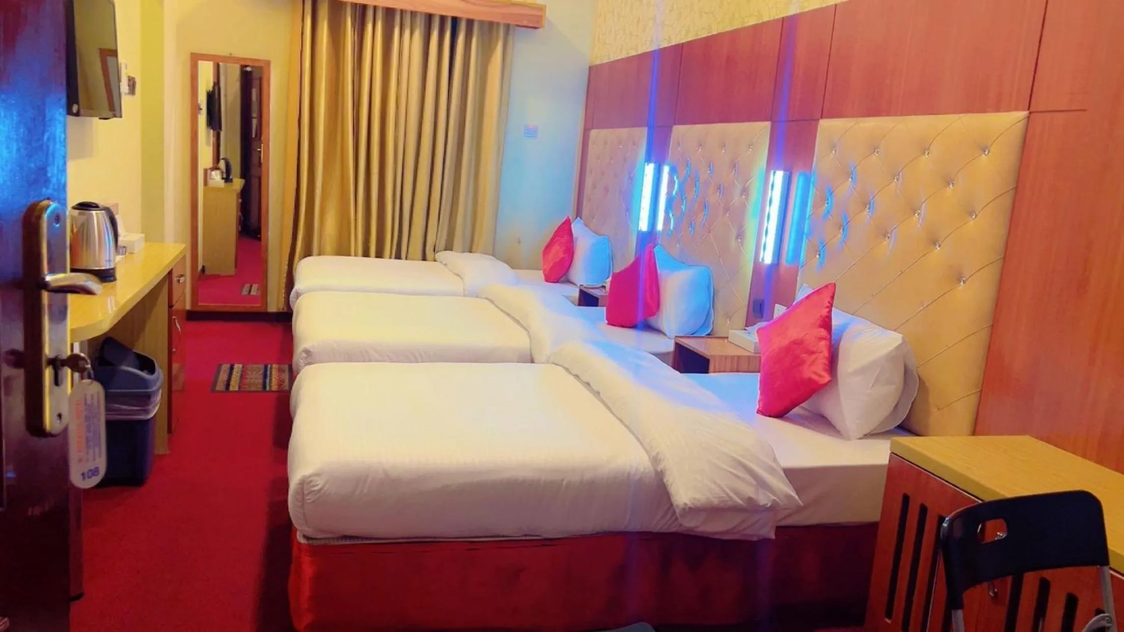 Bed in Parasol Hotel