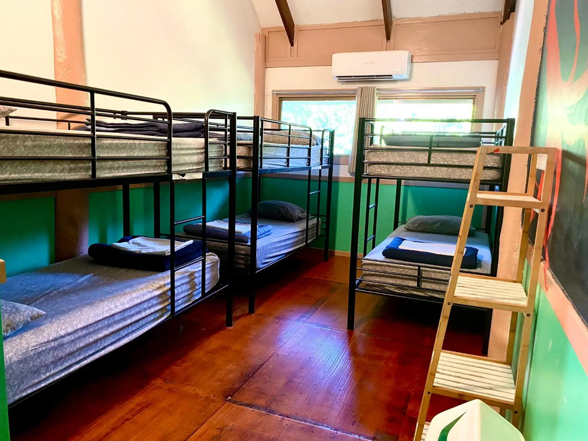 Bed in Jackaroo Treehouse Rainforest Retreat