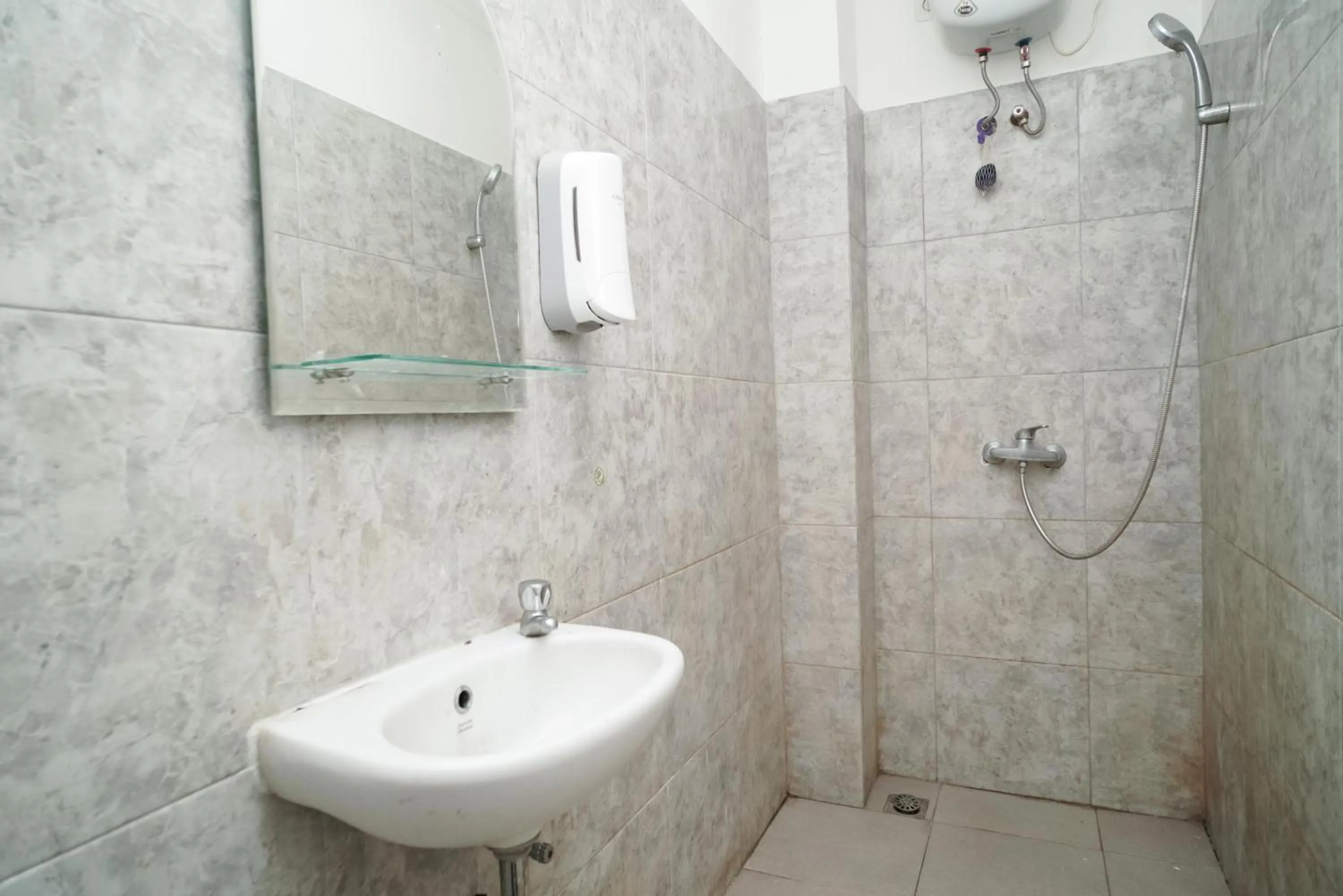 Bathroom in KoolKost near Universitas BINUS Anggrek