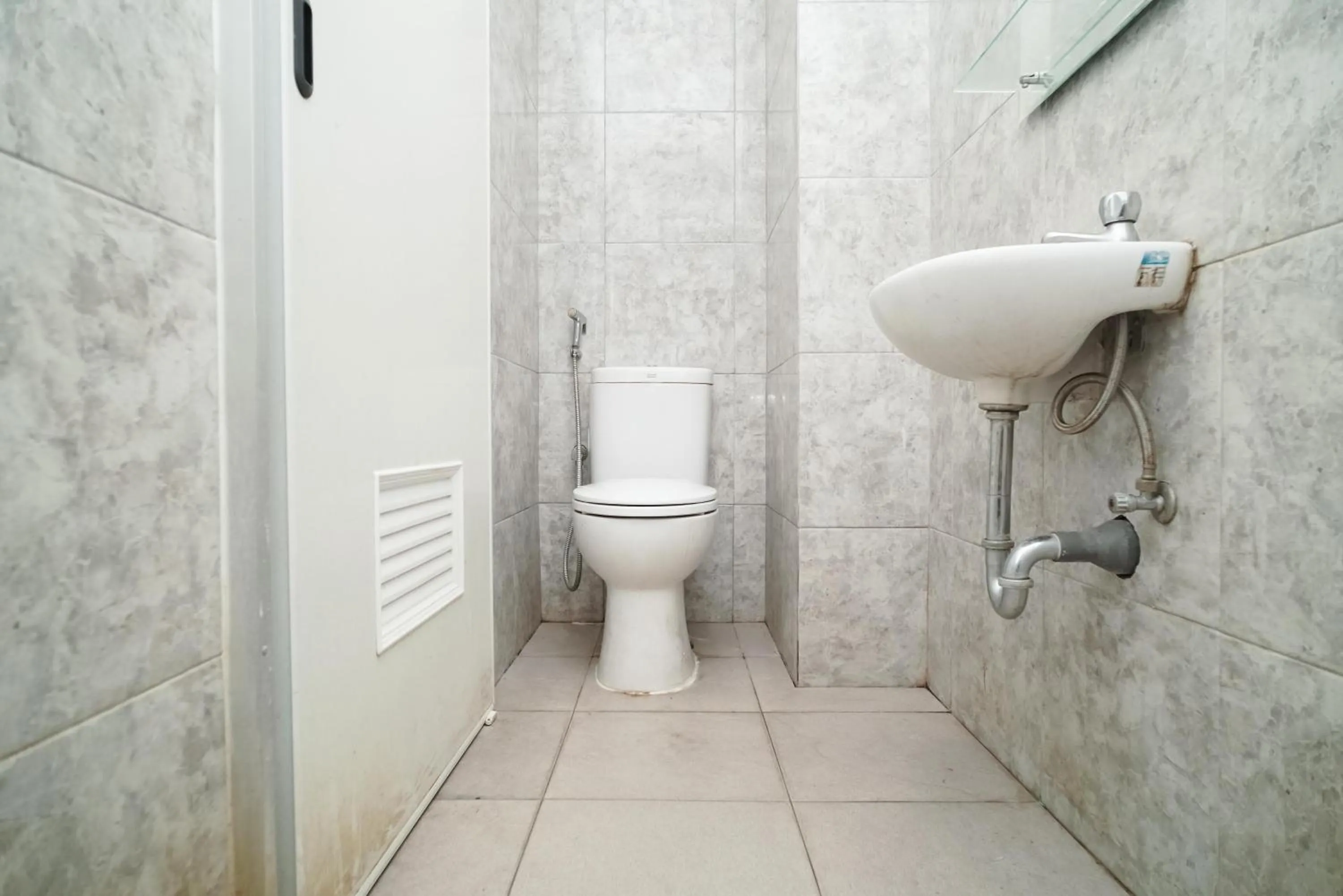 Bathroom in KoolKost near Universitas BINUS Anggrek