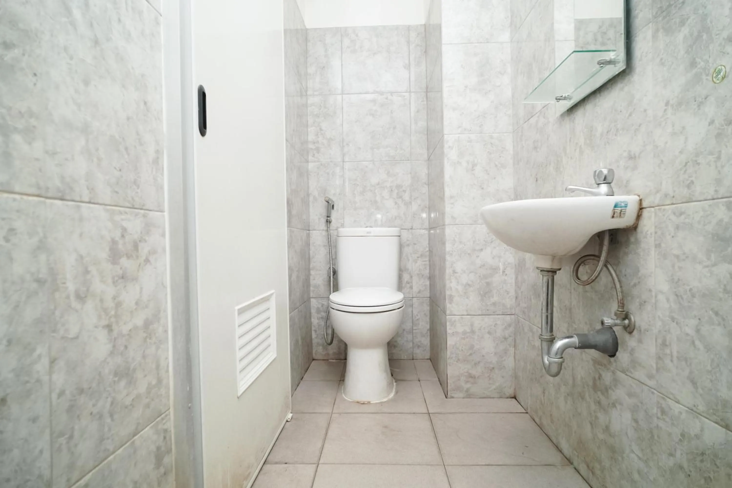 Bathroom in KoolKost near Universitas BINUS Anggrek