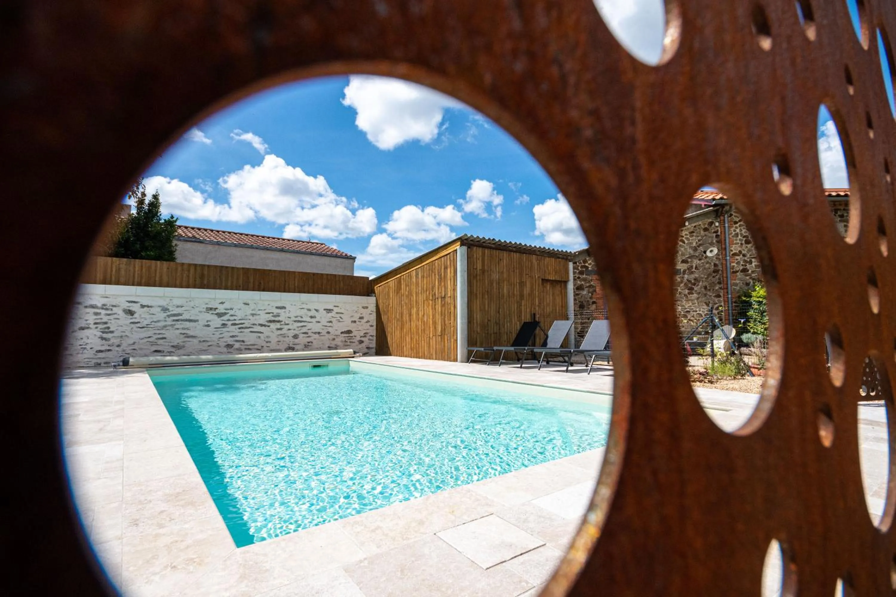 Pool view in Le DOMAINE DES ECOLIERS B&B