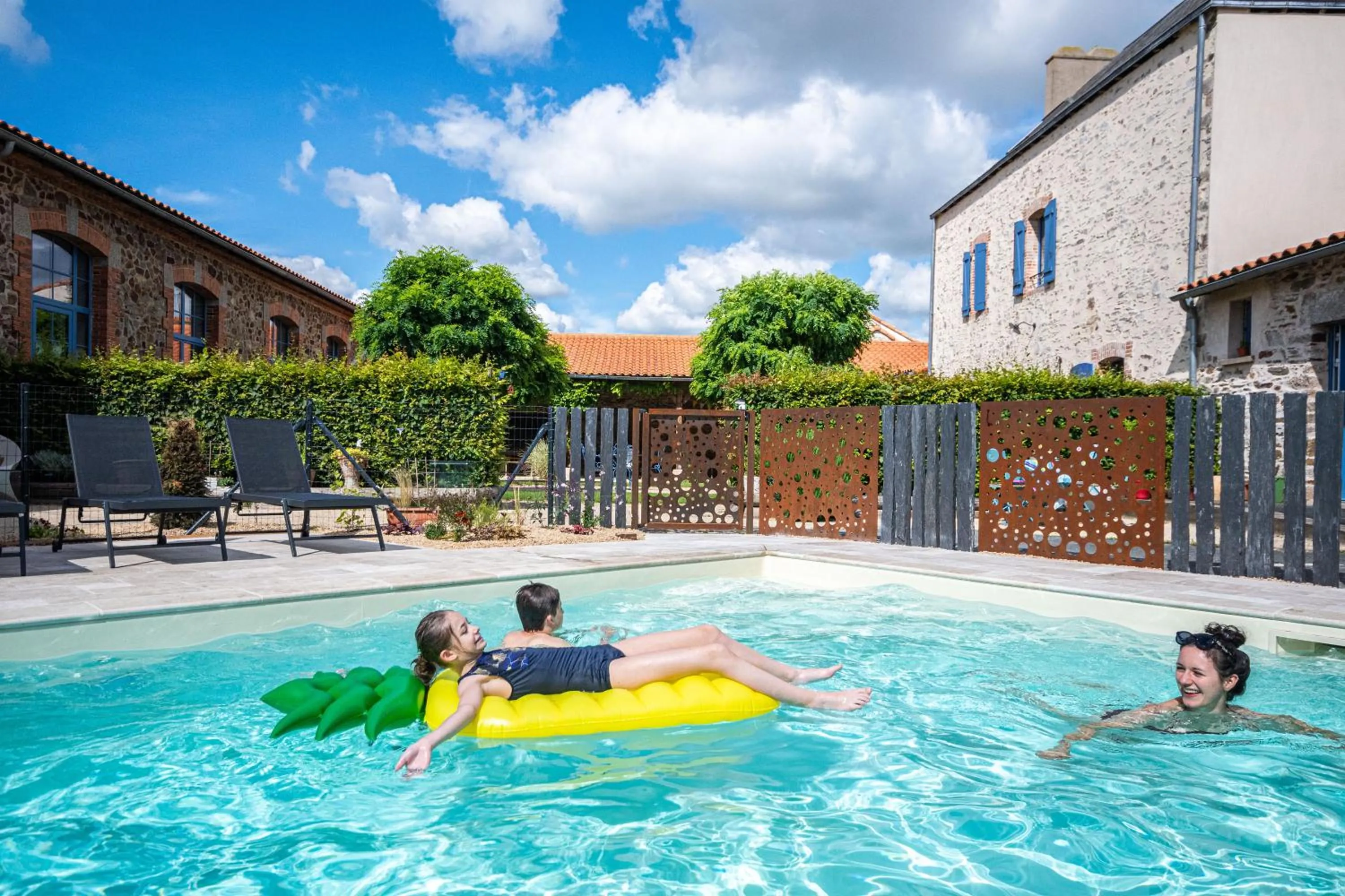 Swimming pool in Le DOMAINE DES ECOLIERS B&B