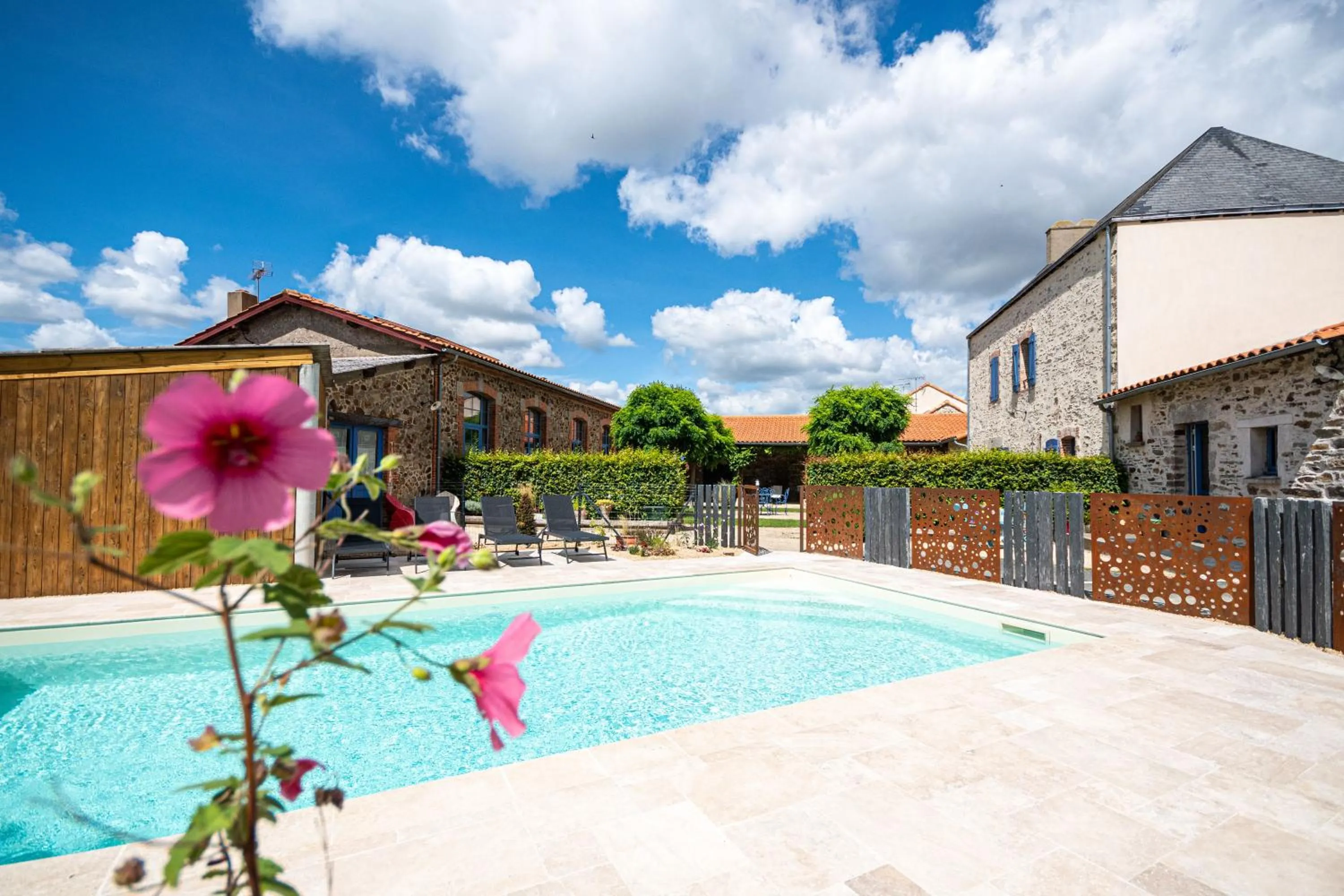 Swimming pool in Le DOMAINE DES ECOLIERS B&B