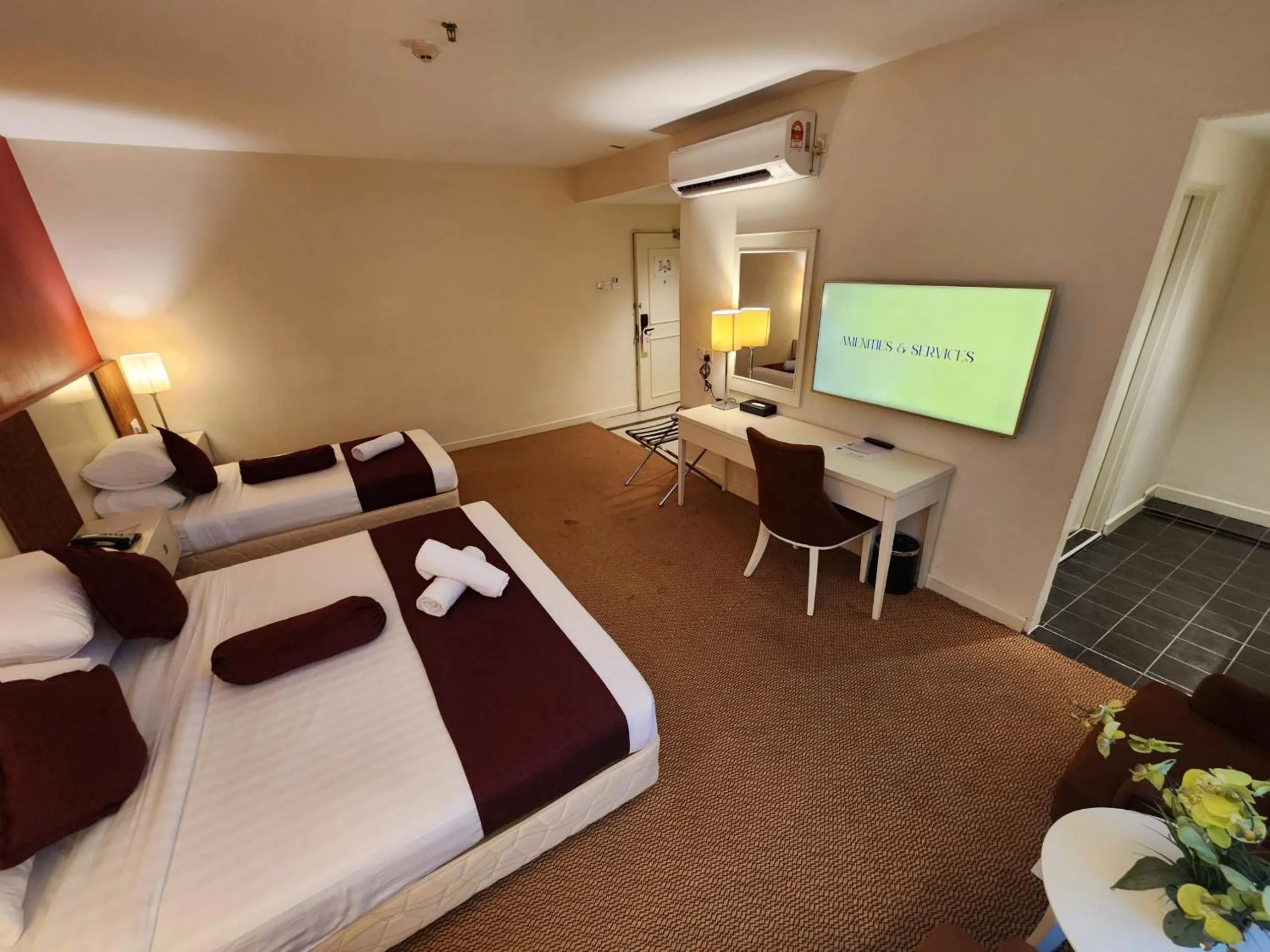 Bed in The Grand Puteri Hotel