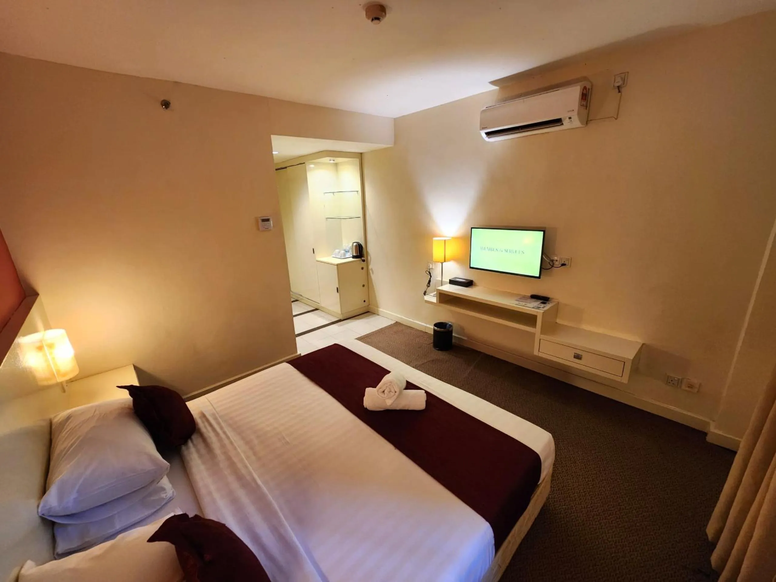 Bed in The Grand Puteri Hotel