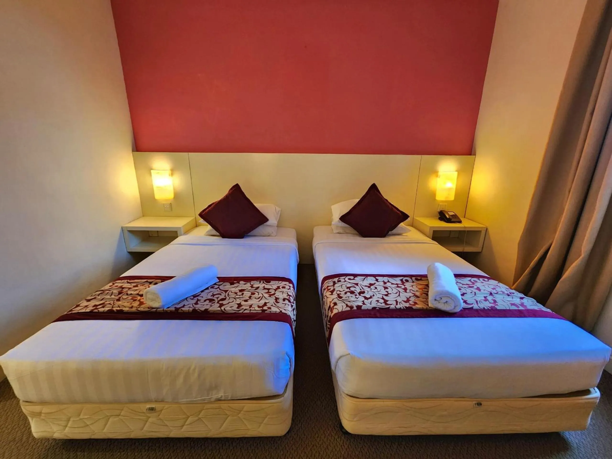 Bed in The Grand Puteri Hotel