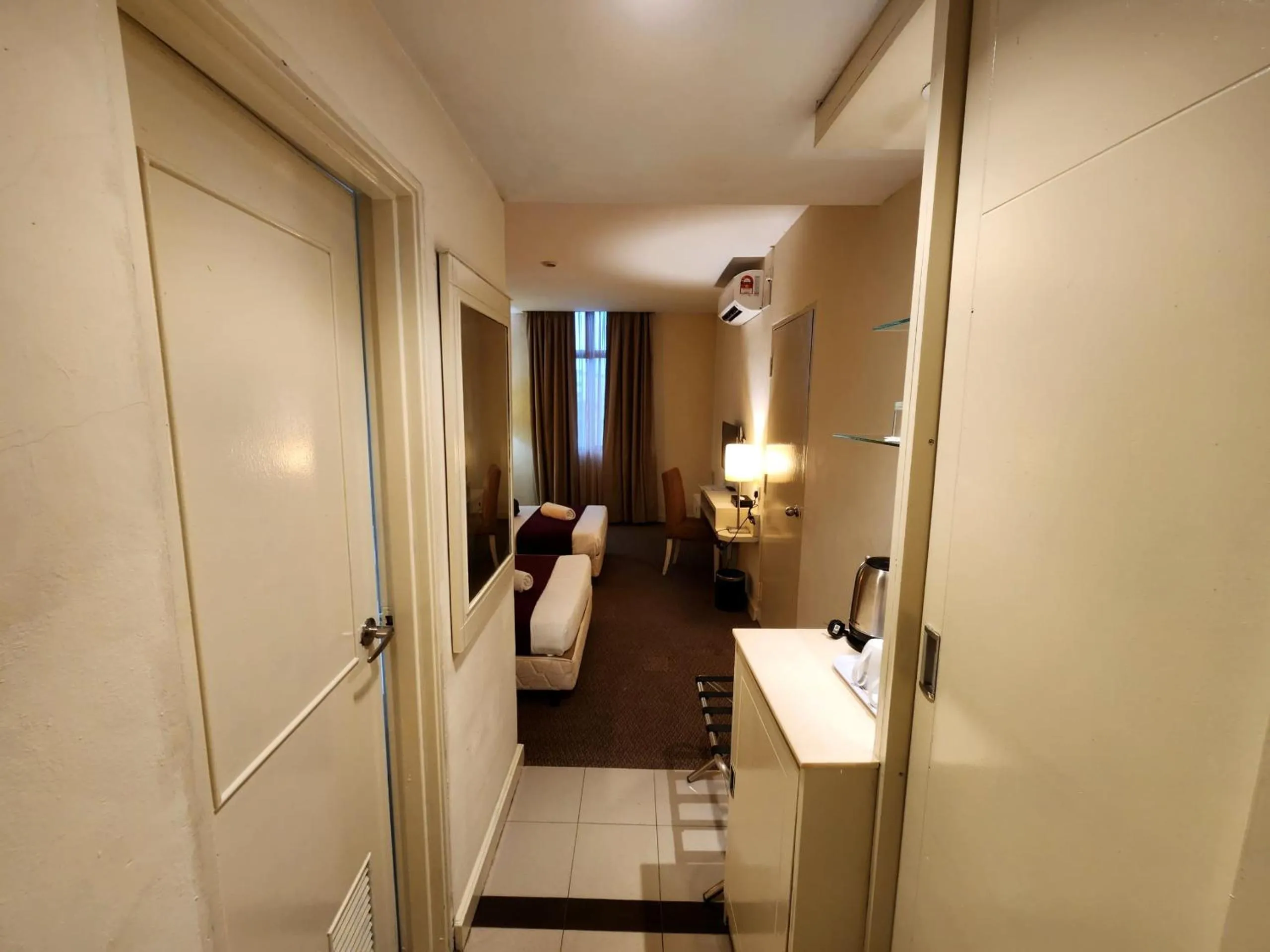 Bed in The Grand Puteri Hotel