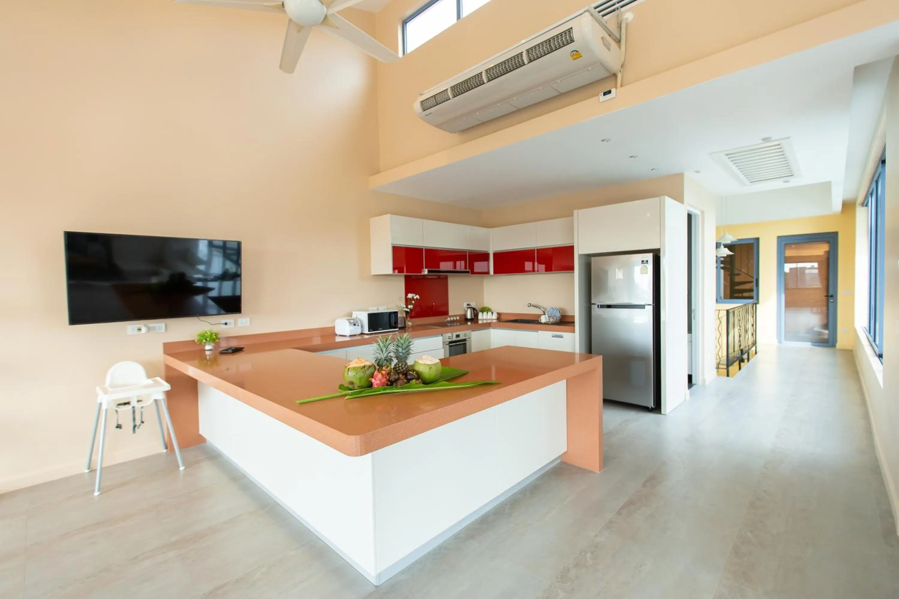 Communal lounge/ TV room in Teetara Villa Patong