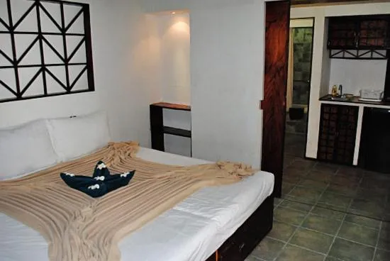 Bed in Palau Plantation Resort