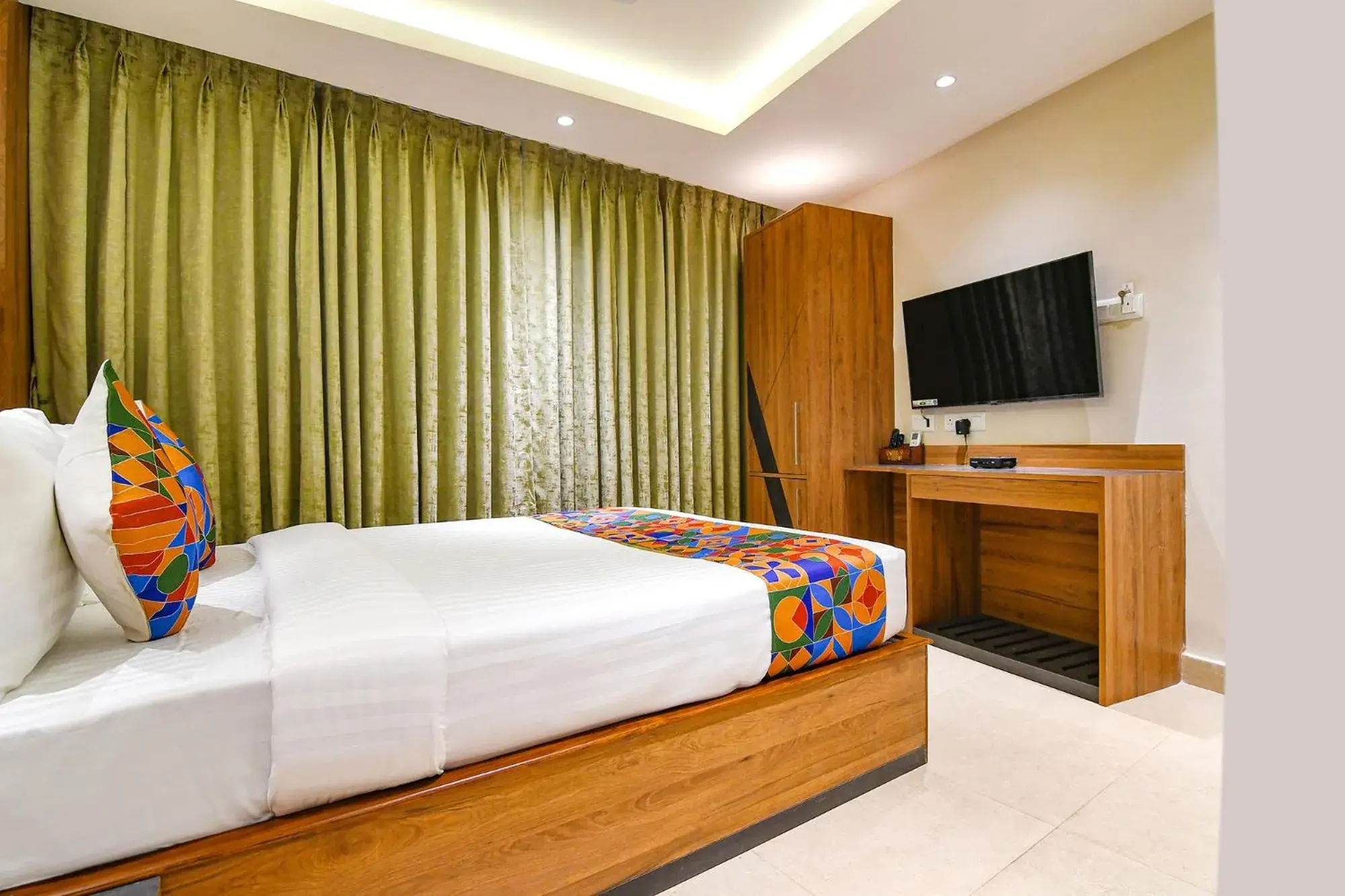Bed in FabHotel Prime Swagatam International Chinar Park Bed in FabHotel Prime Swagatam International Chinar Park