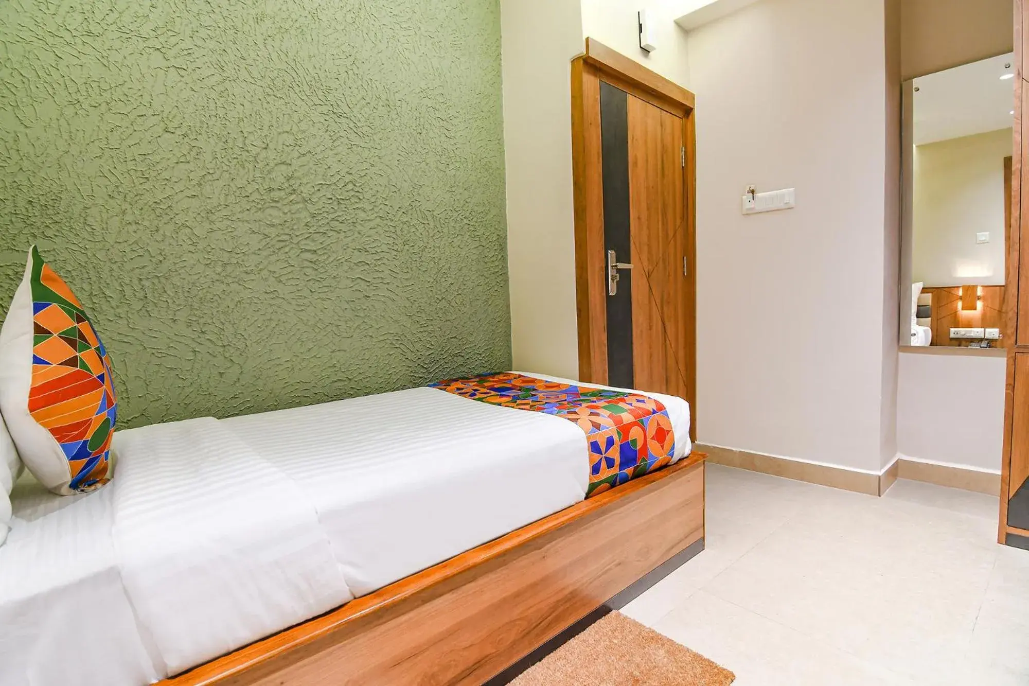 Bed in FabHotel Prime Swagatam International Chinar Park Bed in FabHotel Prime Swagatam International Chinar Park