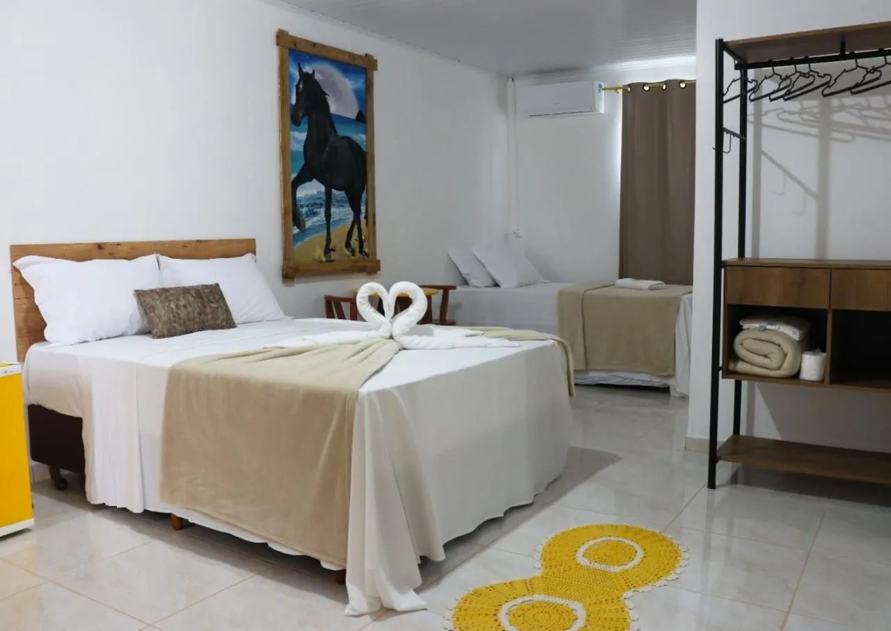 Bed in Pousada Alegria do Cowboy