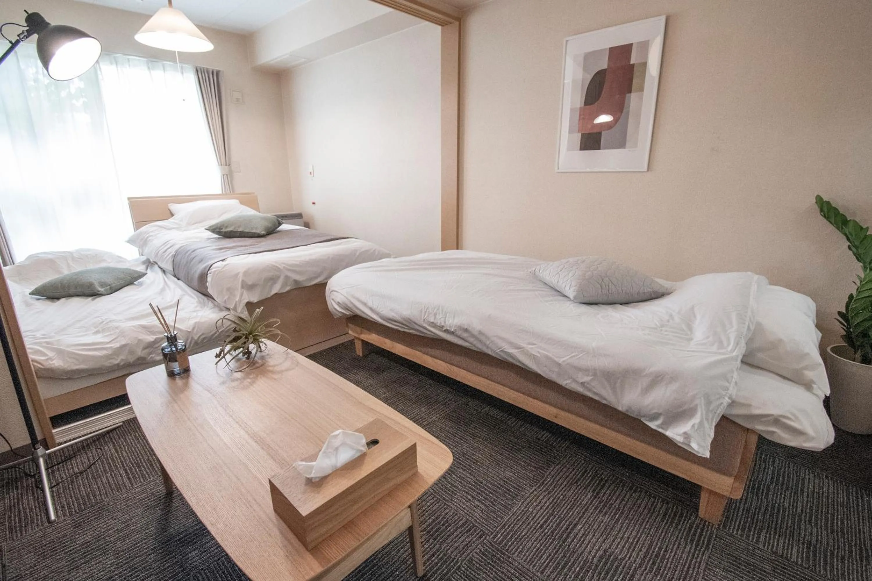 Bed in UCHI Living Stay Otaru Suitengu
