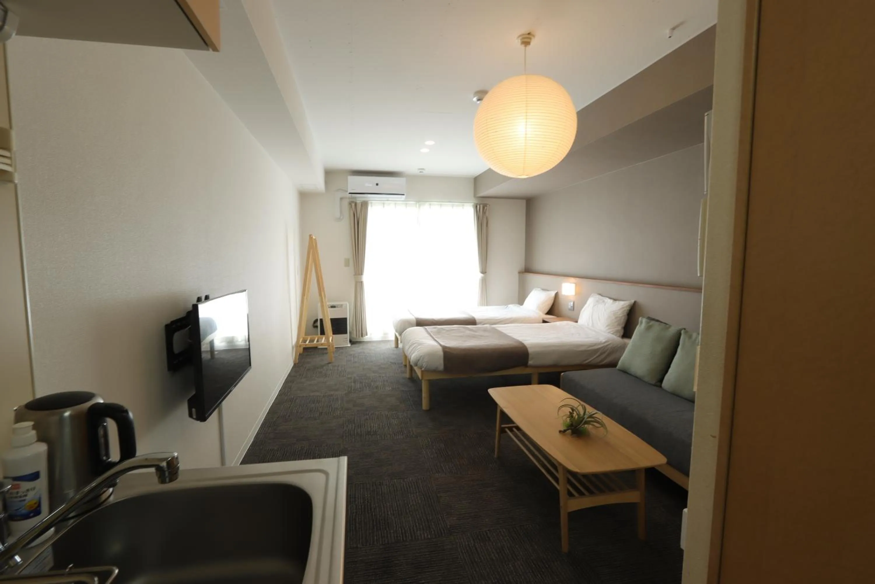 Photo of the whole room, Bed in UCHI Living Stay Otaru Suitengu