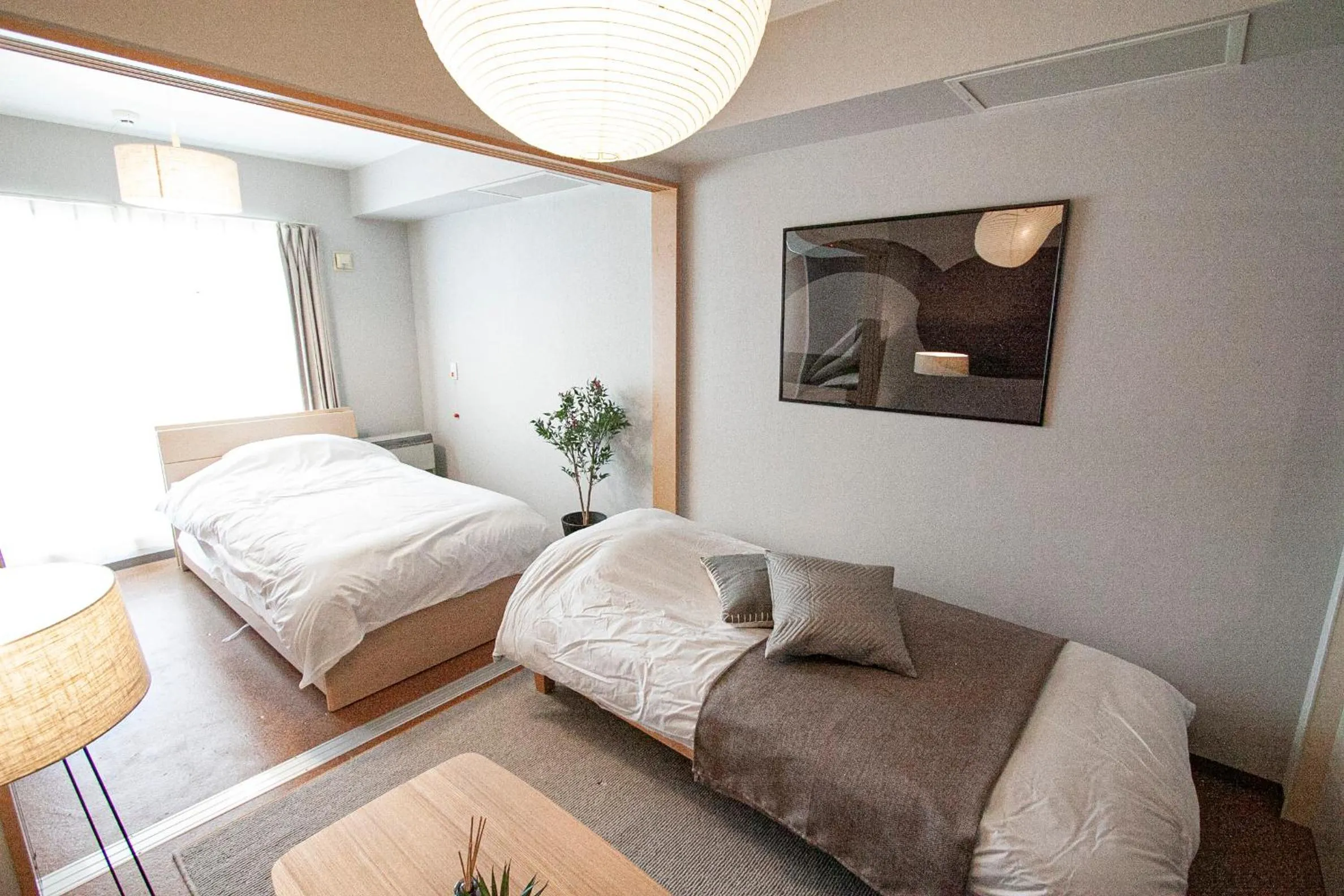 Bed in UCHI Living Stay Otaru Suitengu