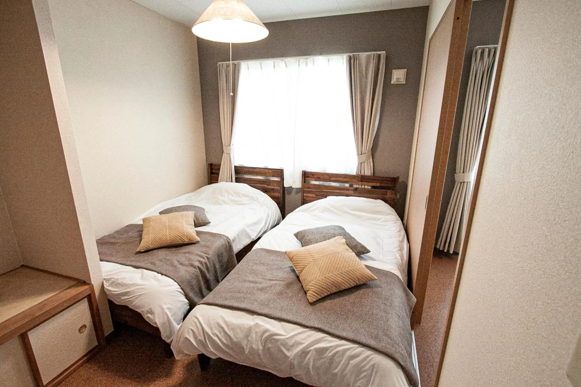 Bed in UCHI Living Stay Otaru Suitengu