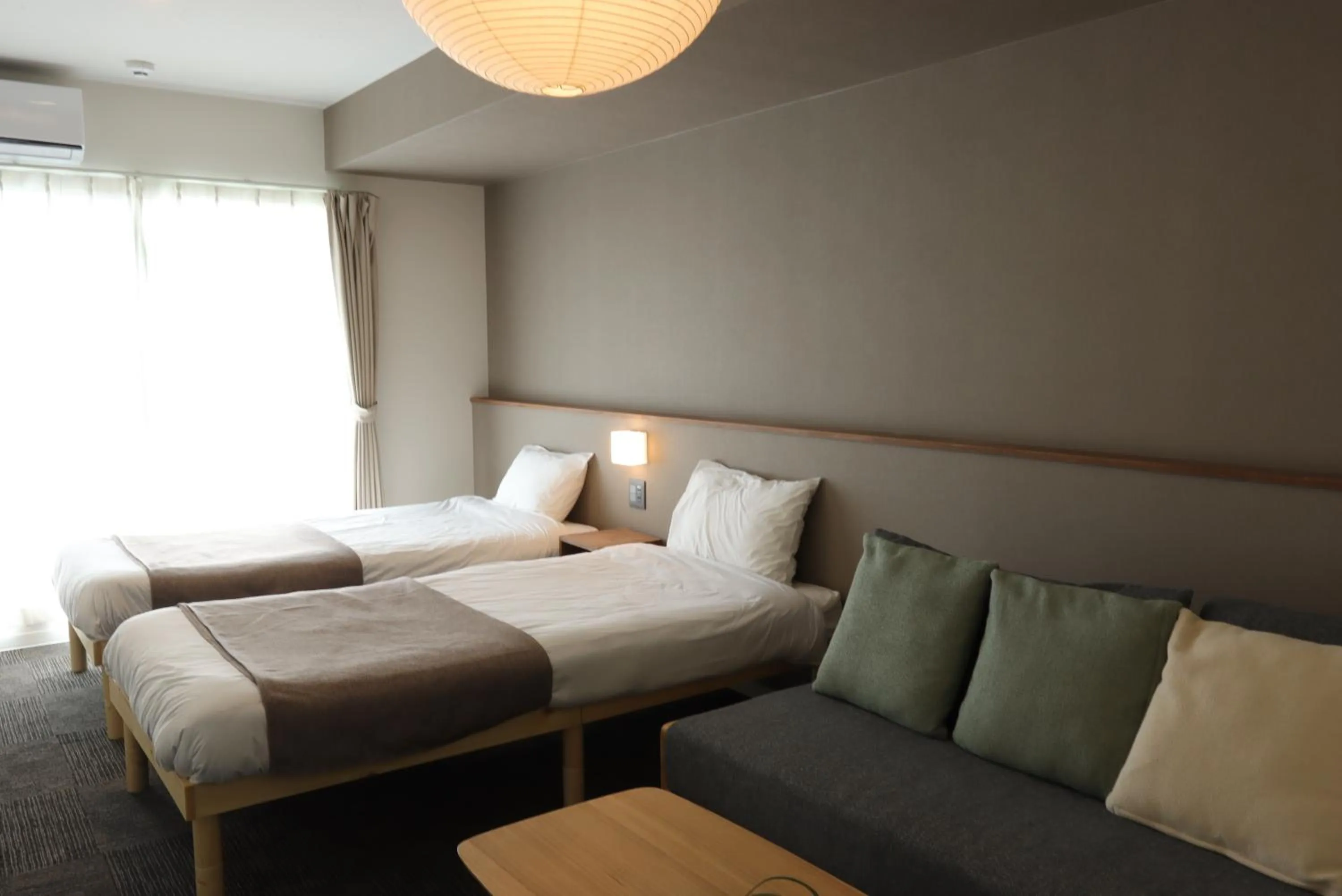 Photo of the whole room, Bed in UCHI Living Stay Otaru Suitengu