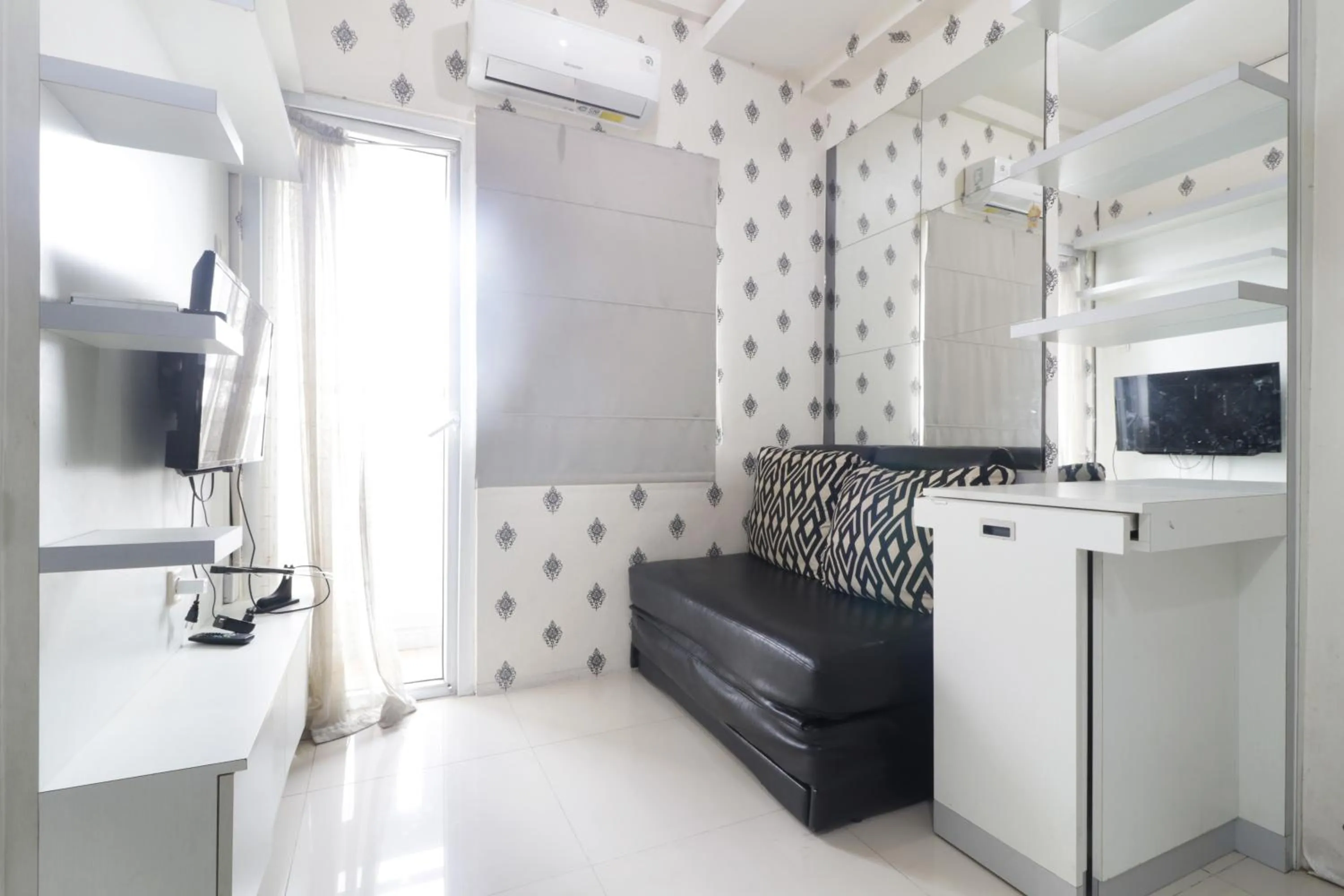 Living room in Green Pramuka City by SR Property