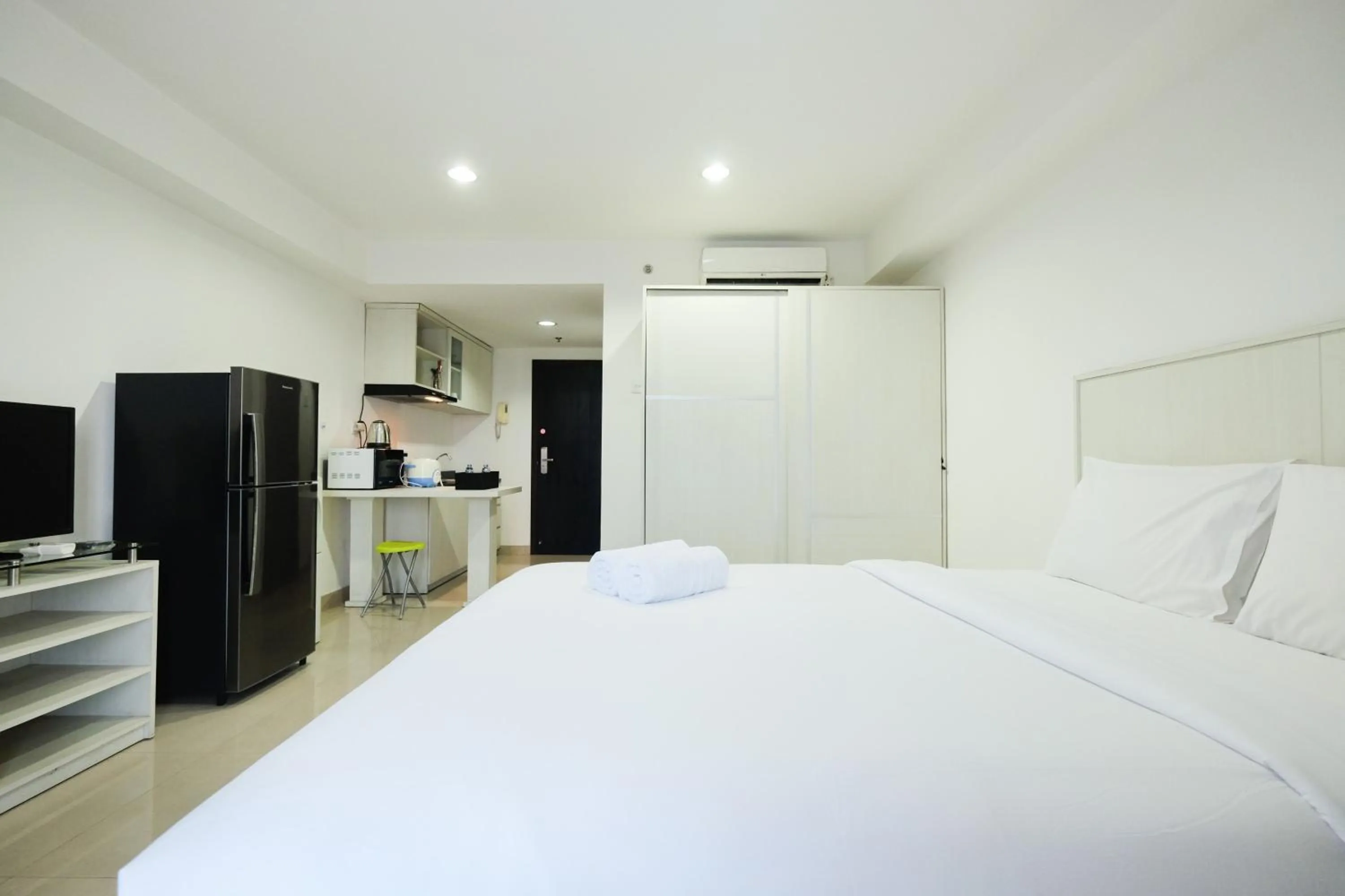 Bed in Exclusive Studio Tamansari The Hive Apartment in Strategic Location By Travelio