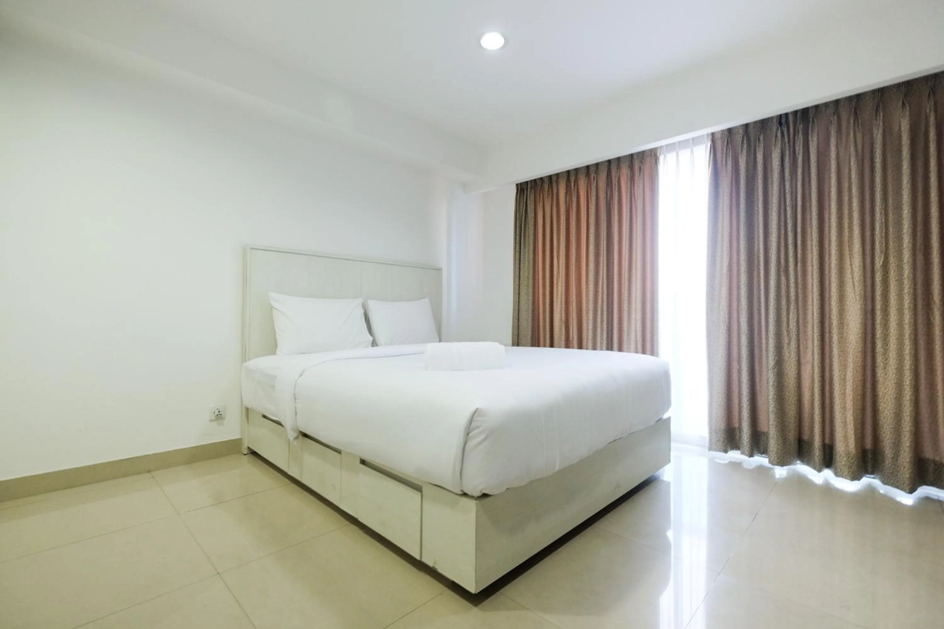 Bed in Exclusive Studio Tamansari The Hive Apartment in Strategic Location By Travelio