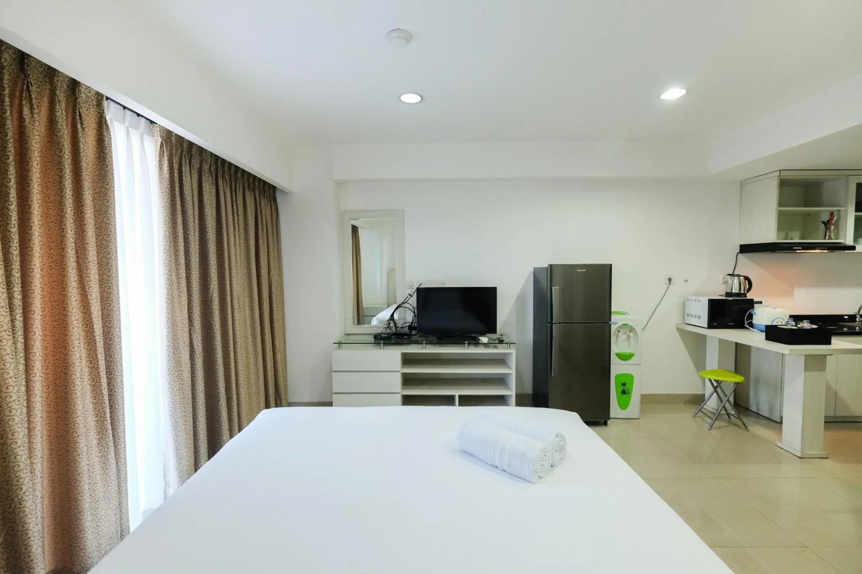 Bed in Exclusive Studio Tamansari The Hive Apartment in Strategic Location By Travelio