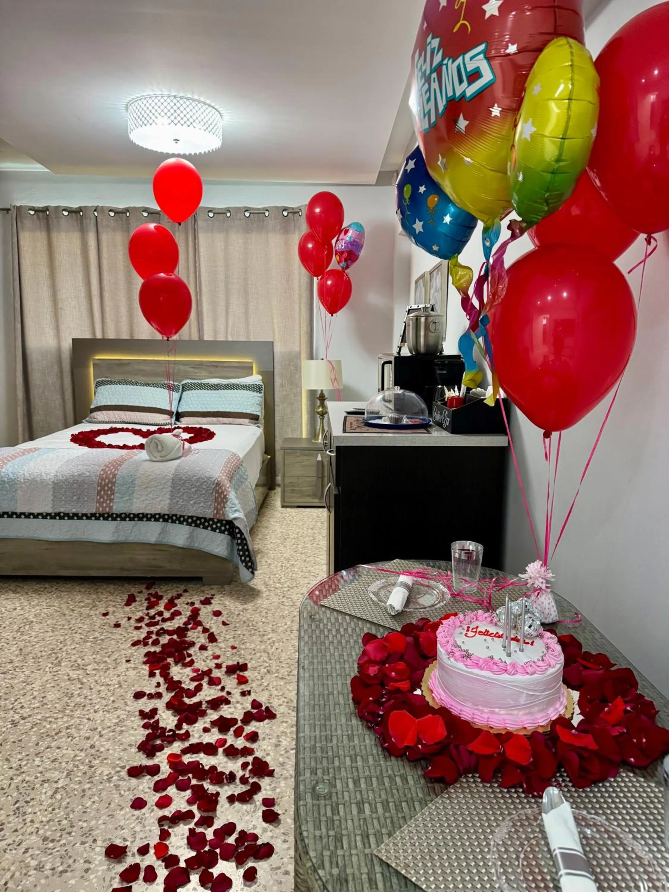 Bed in Itza-Bella Suites