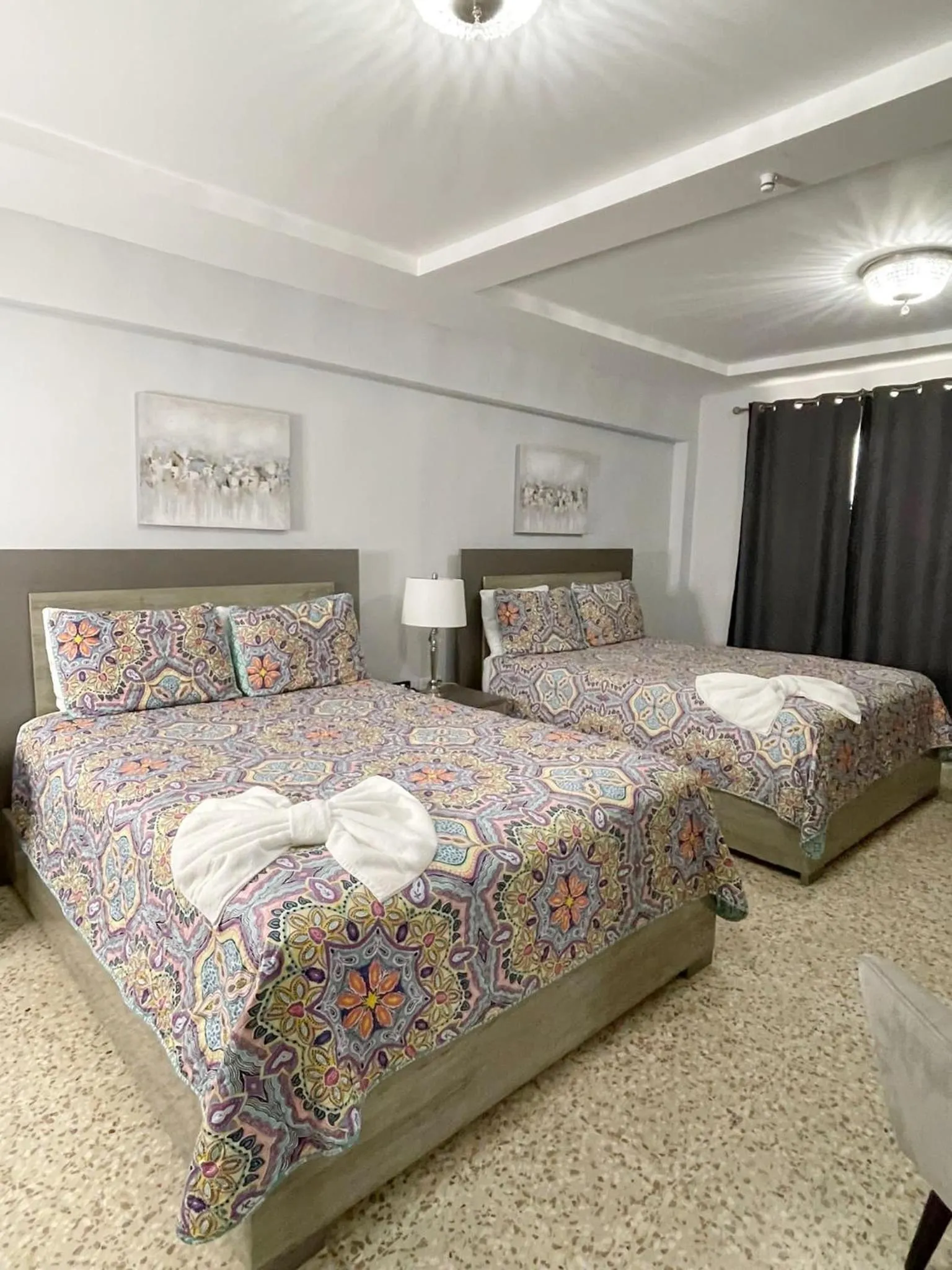 Bed in Itza-Bella Suites