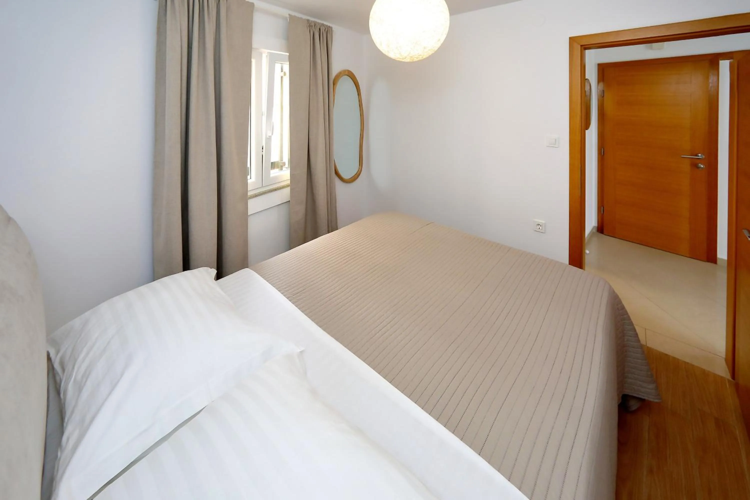 Bed in Apartments Nina