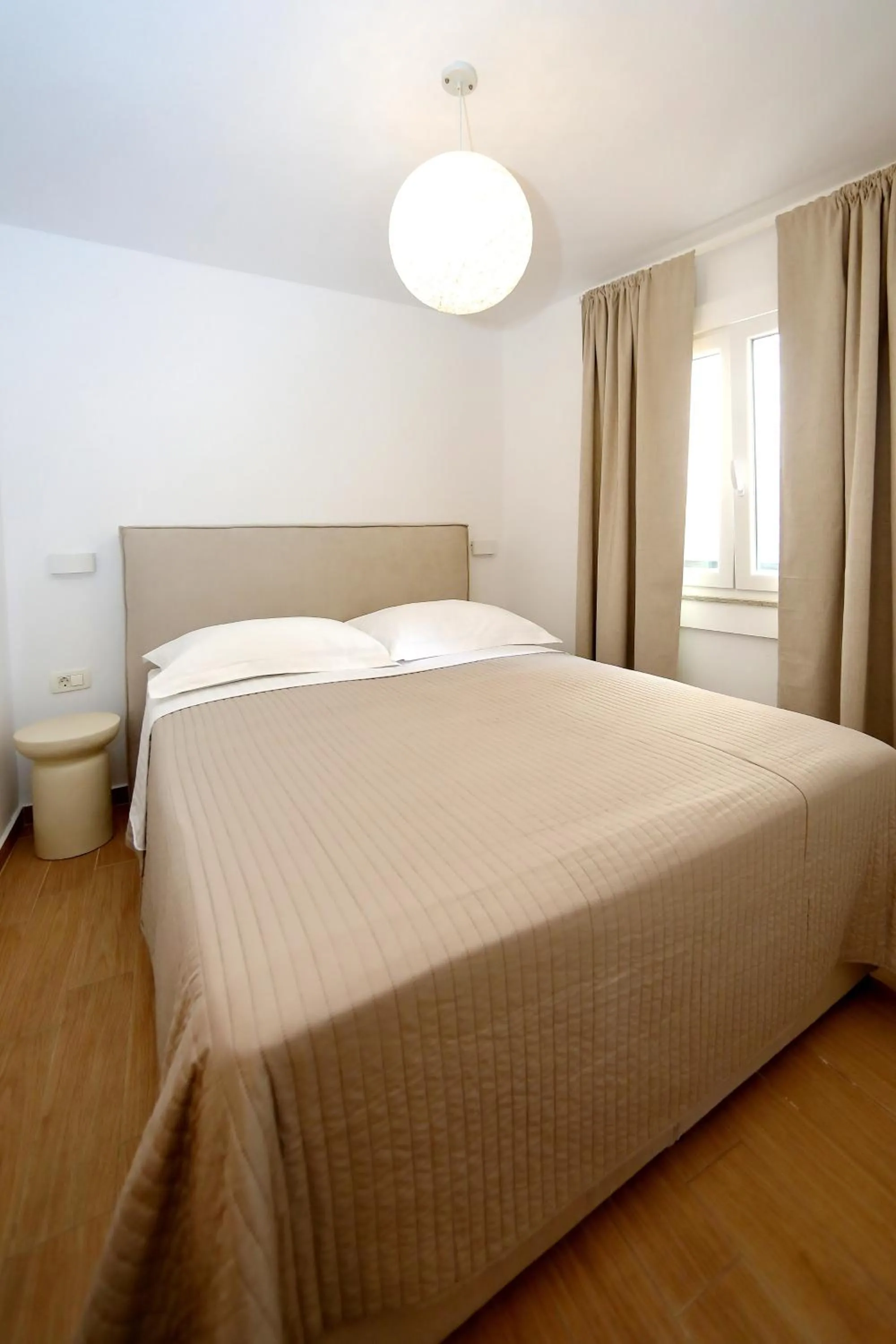 Bed in Apartments Nina