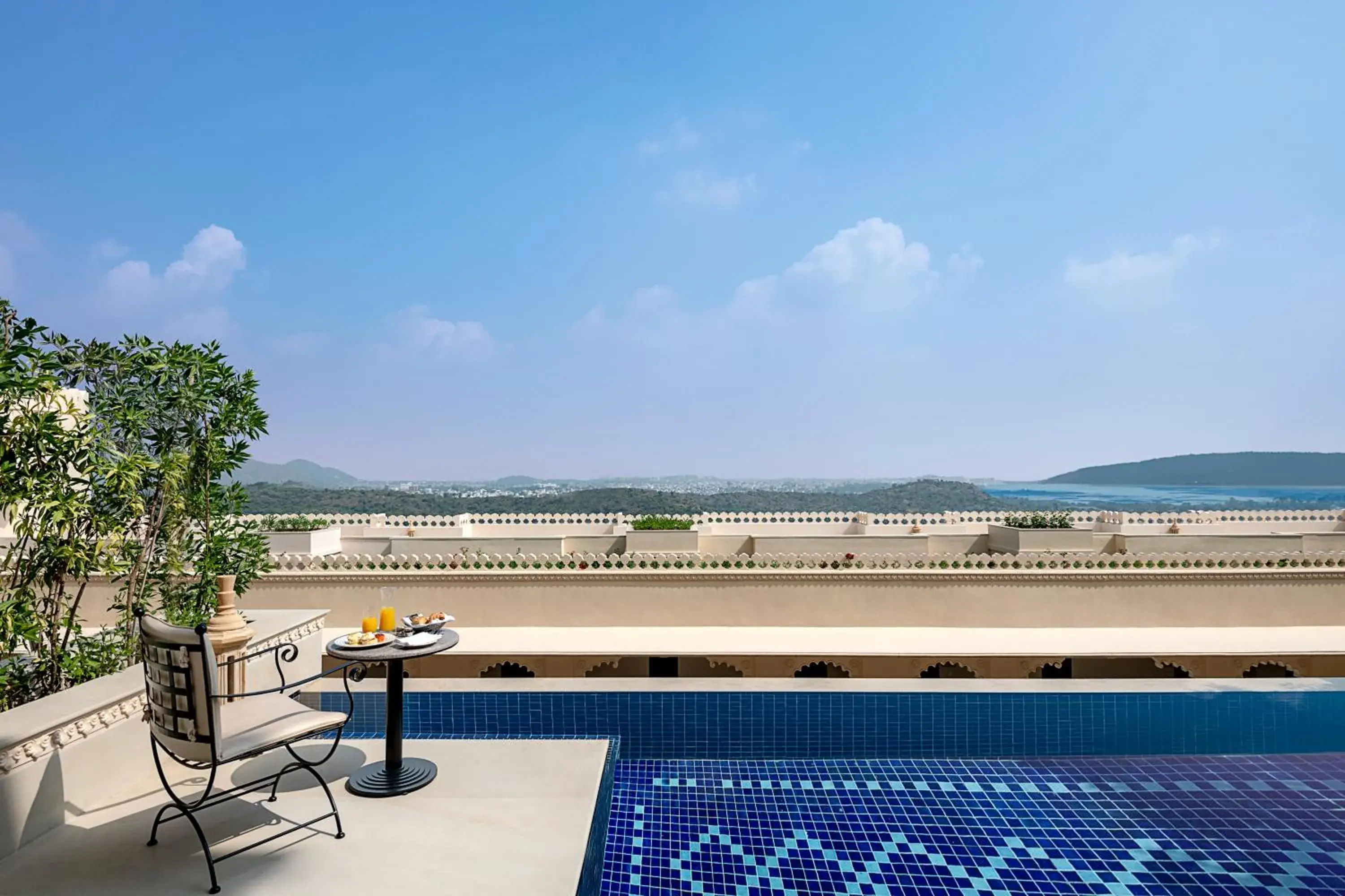 Swimming pool in Aurika, Udaipur - Luxury by Lemon Tree Hotels Swimming pool in Aurika, Udaipur - Luxury by Lemon Tree Hotels