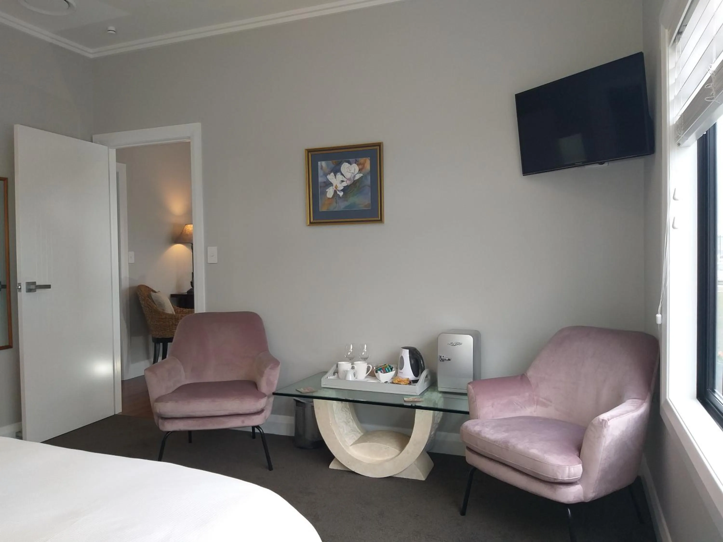 Seating area, Bed in Stay Taupo