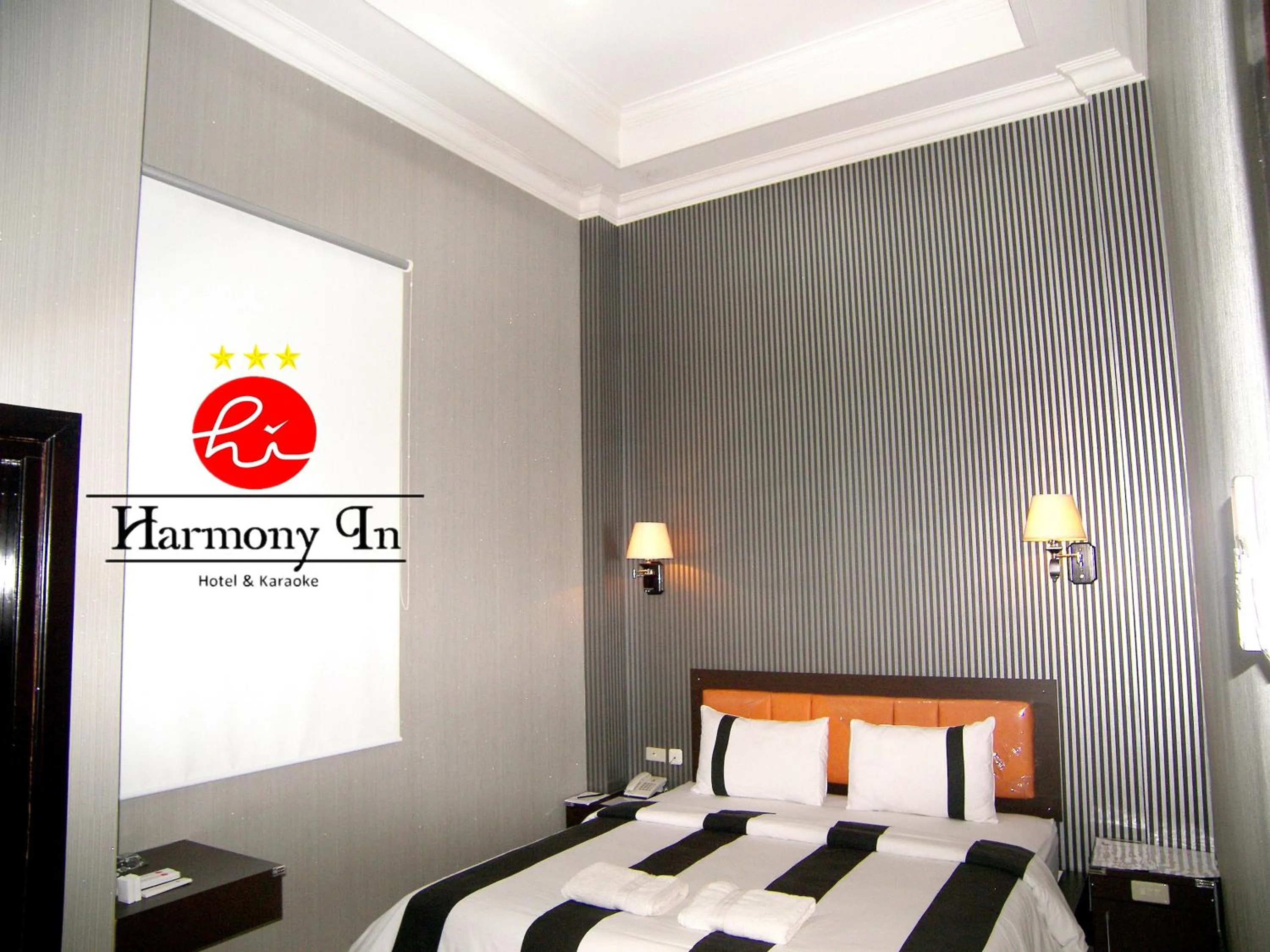 Bed in Hotel Harmony In & Karaoke