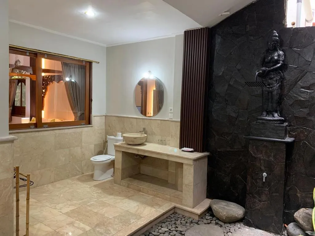 Bathroom in Three Brothers Bali Legian Bungalows & Villas