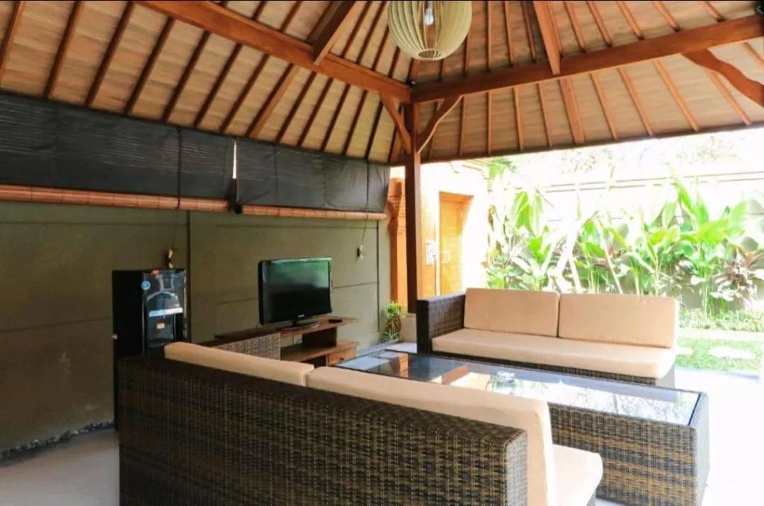 Communal lounge/ TV room in Three Brothers Bali Legian Bungalows & Villas