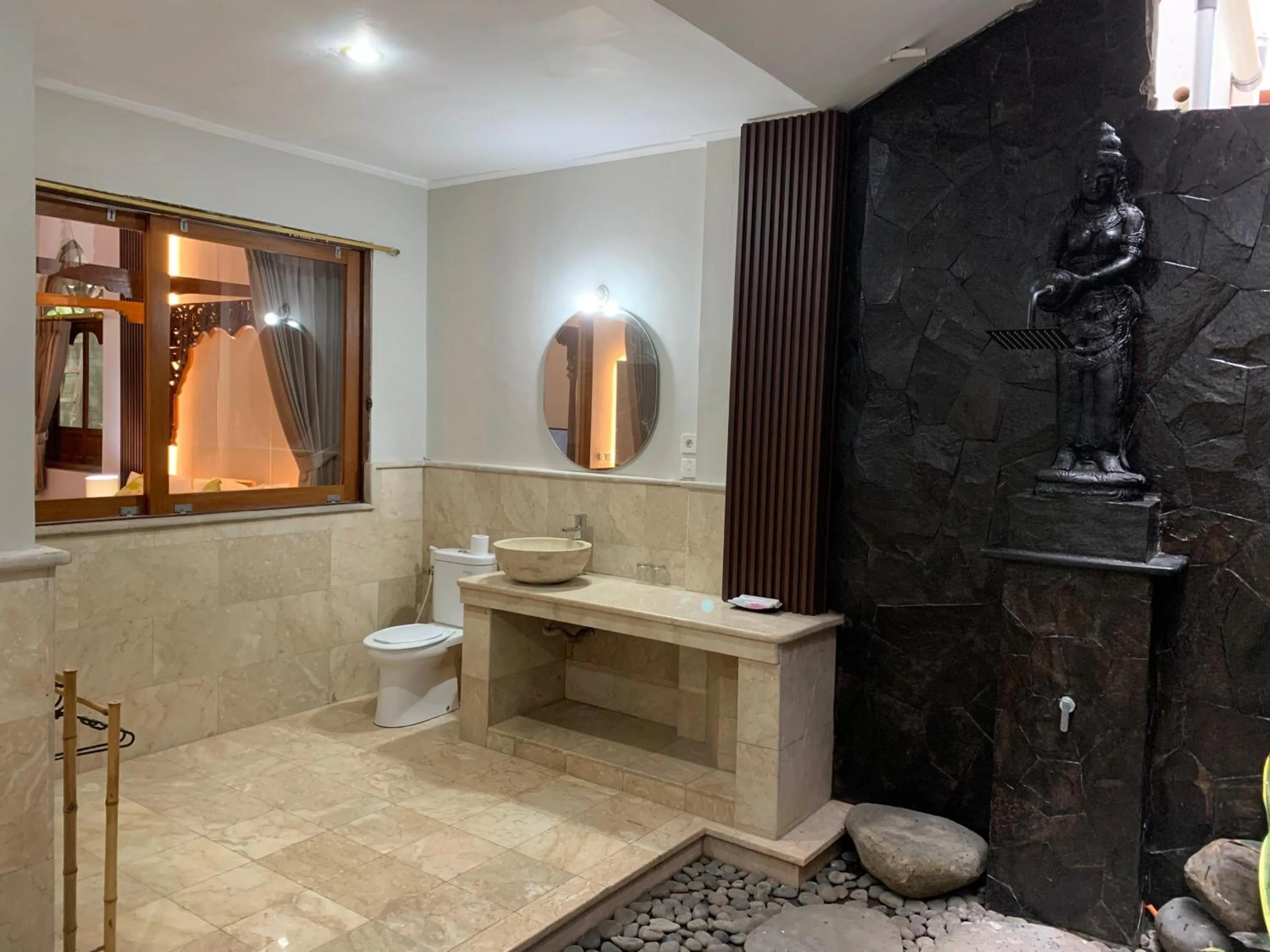 Bathroom in Three Brothers Bali Legian Bungalows & Villas