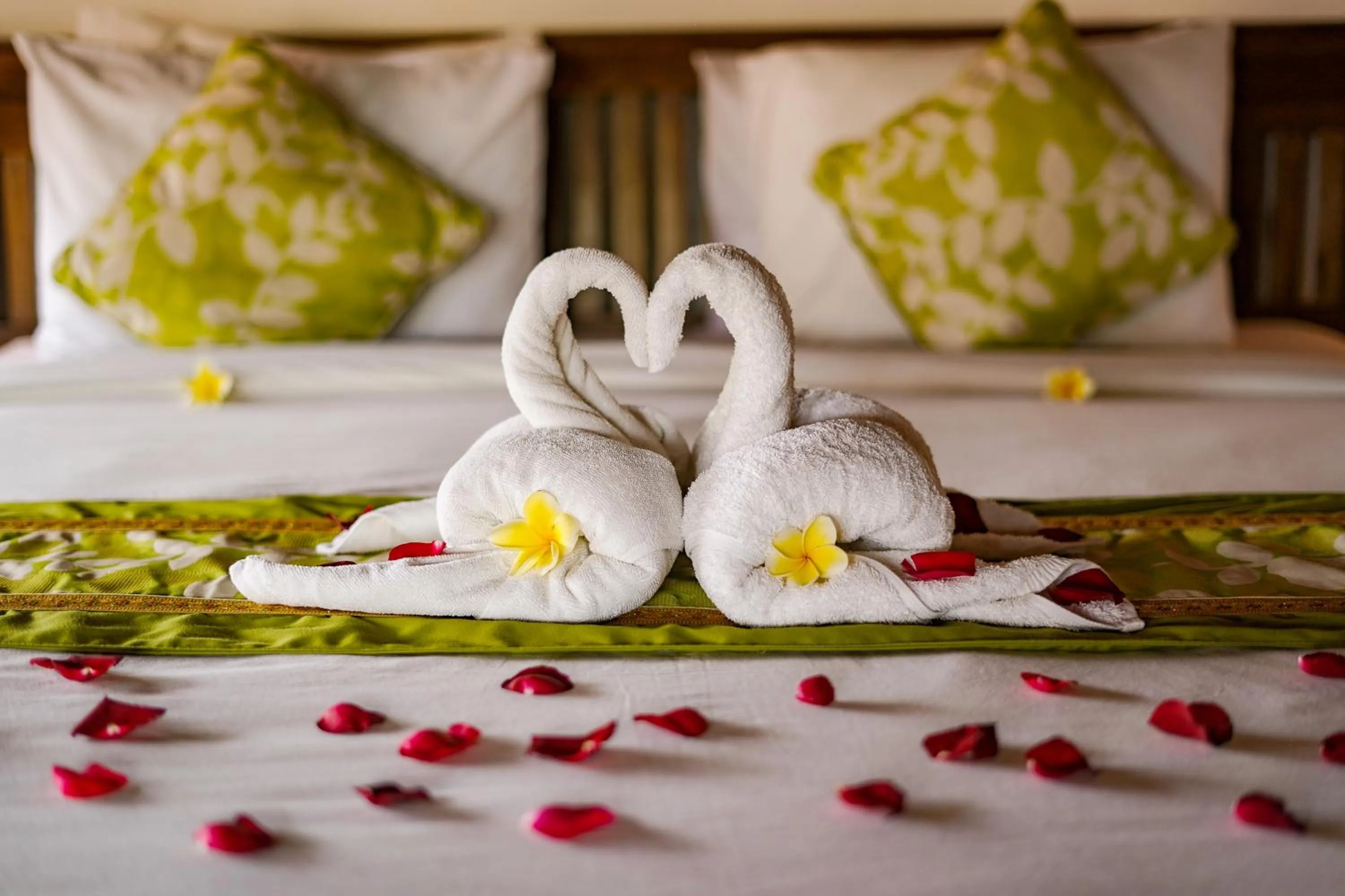 Bed in Three Brothers Bali Legian Bungalows & Villas