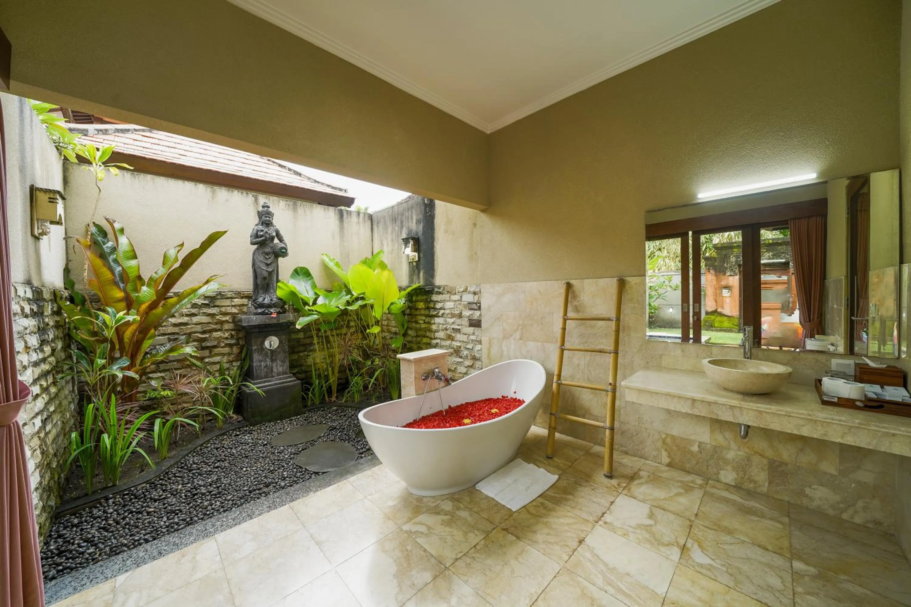 Bathroom in Three Brothers Bali Legian Bungalows & Villas
