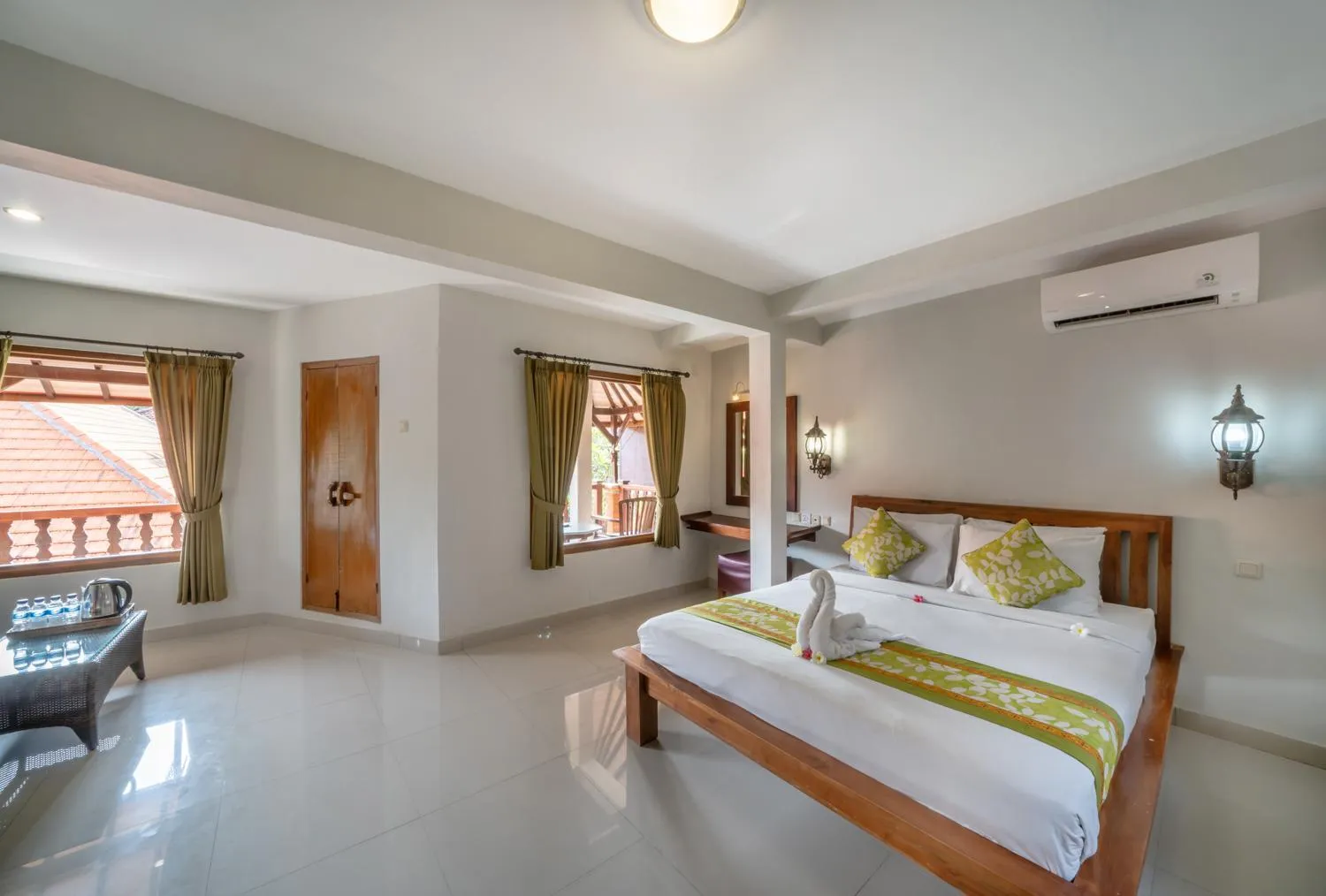 Bed in Three Brothers Bali Legian Bungalows & Villas