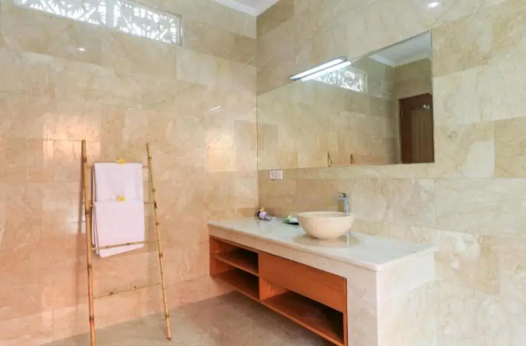 Bathroom in Three Brothers Bali Legian Bungalows & Villas Bathroom in Three Brothers Bali Legian Bungalows & Villas