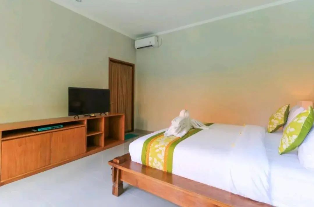 Bed in Three Brothers Bali Legian Bungalows & Villas Bed in Three Brothers Bali Legian Bungalows & Villas