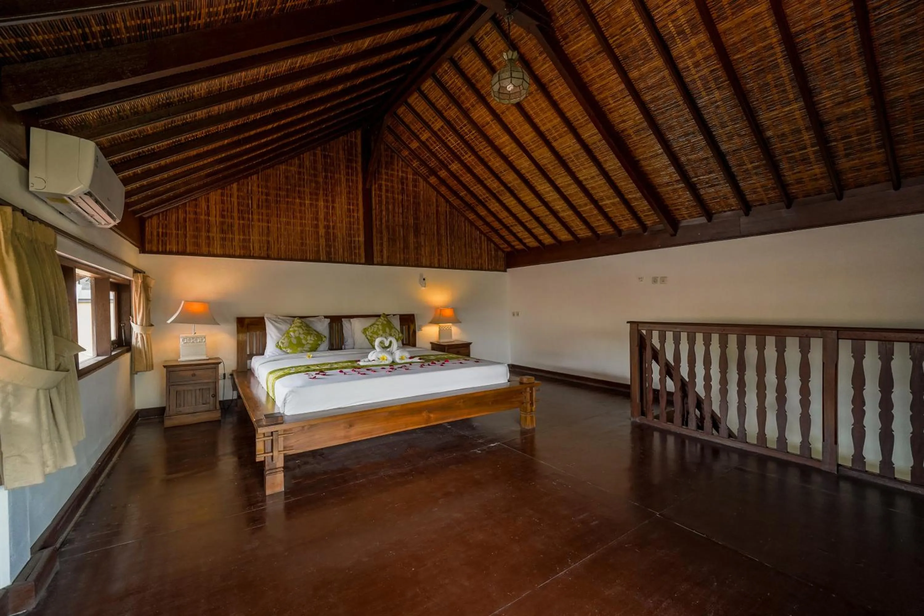 Bed in Three Brothers Bali Legian Bungalows & Villas