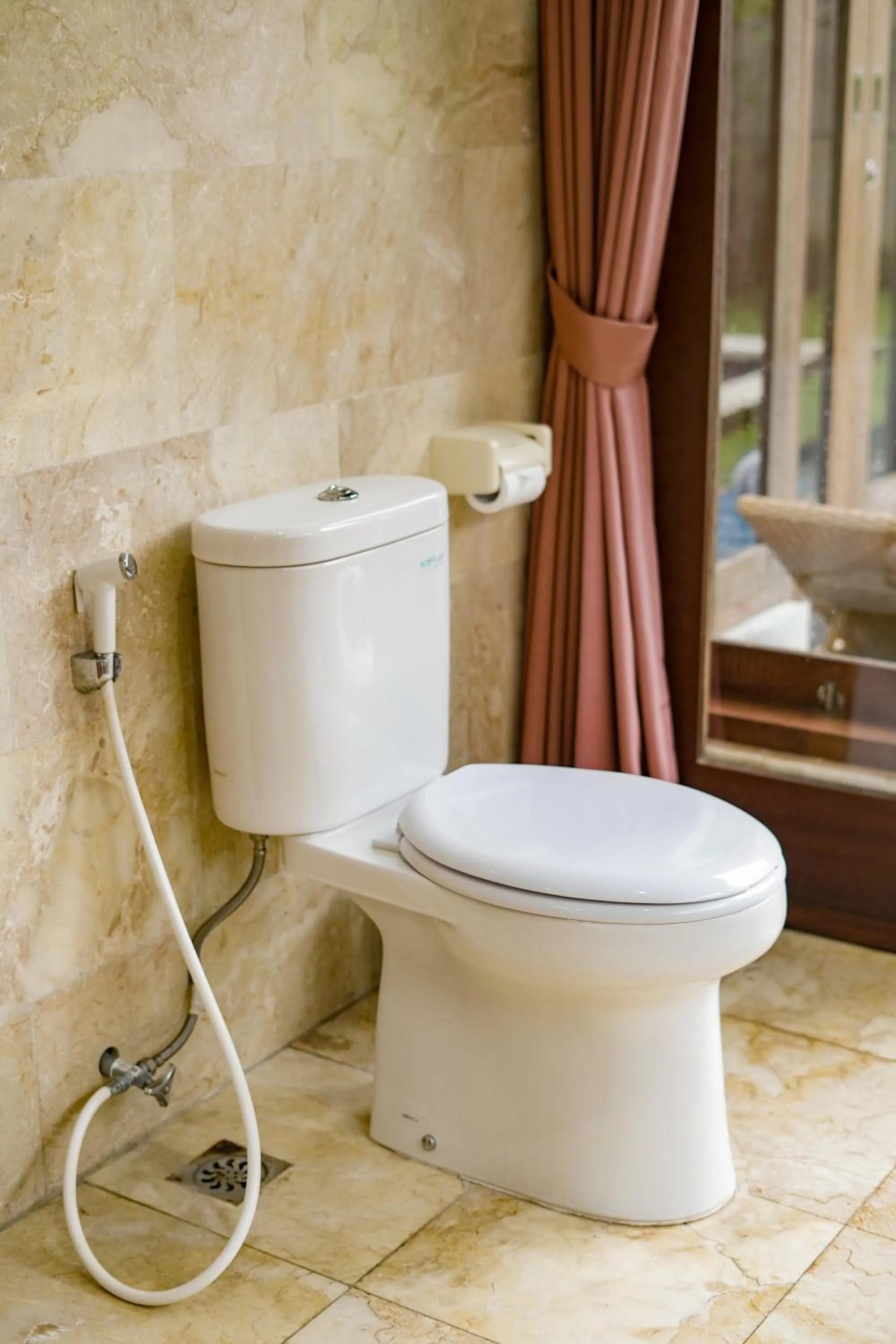 Toilet in Three Brothers Bali Legian Bungalows & Villas