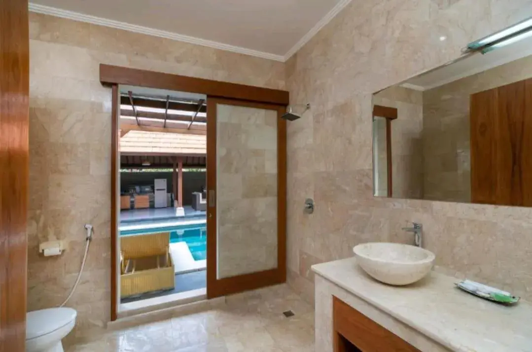 Bathroom in Three Brothers Bali Legian Bungalows & Villas Bathroom in Three Brothers Bali Legian Bungalows & Villas