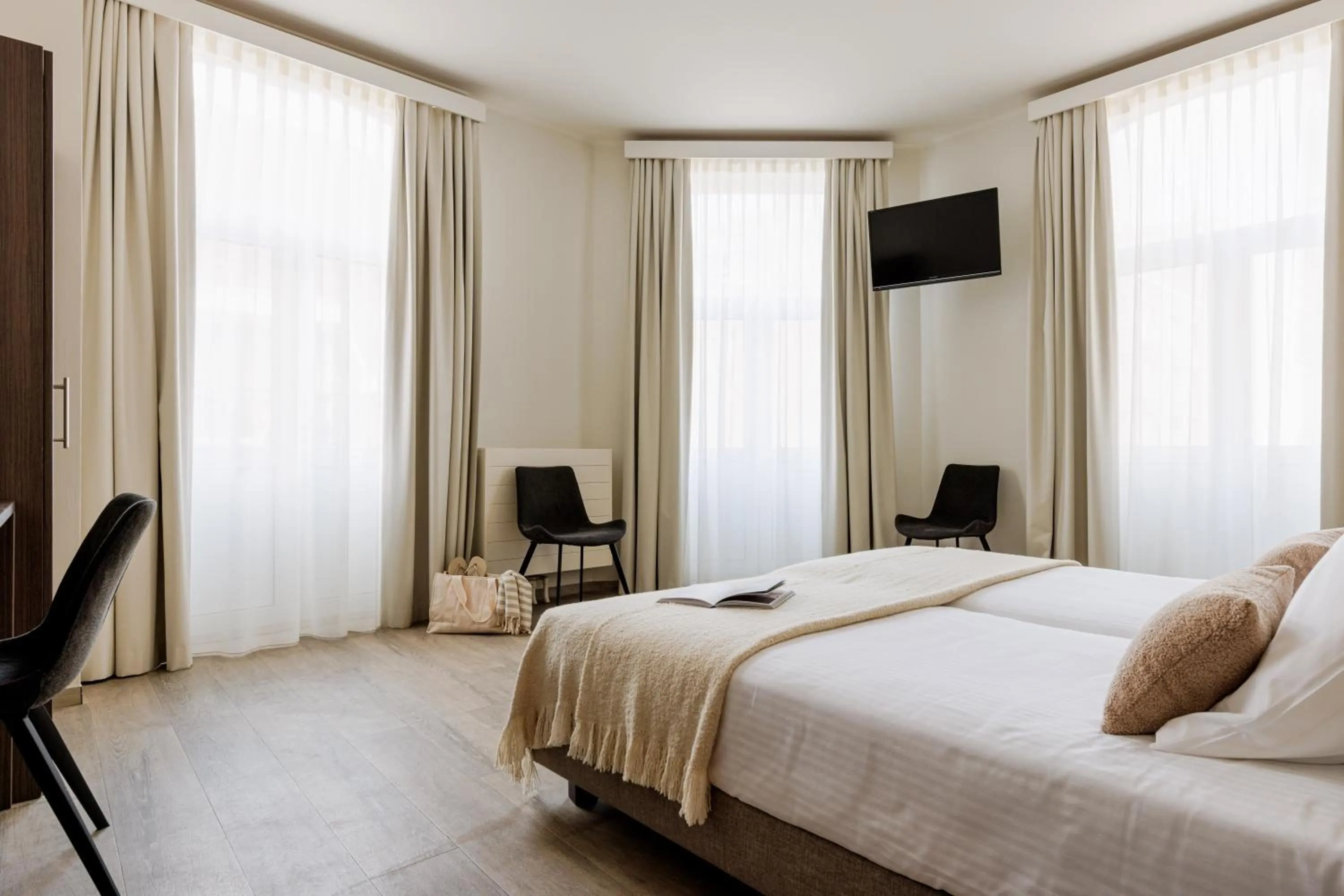 Bed in Hotel Corner House by WP Hotels