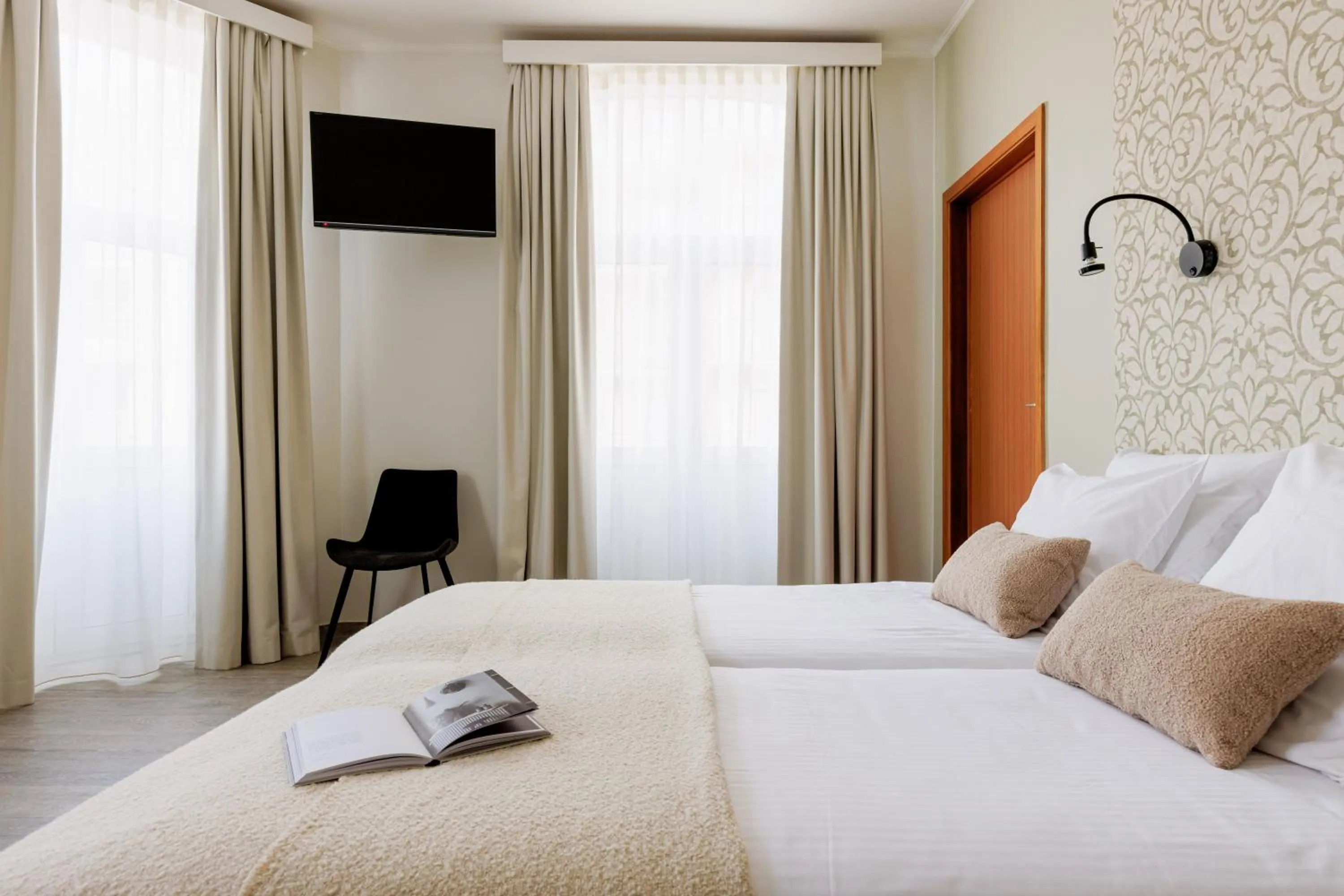 Bed in Hotel Corner House by WP Hotels