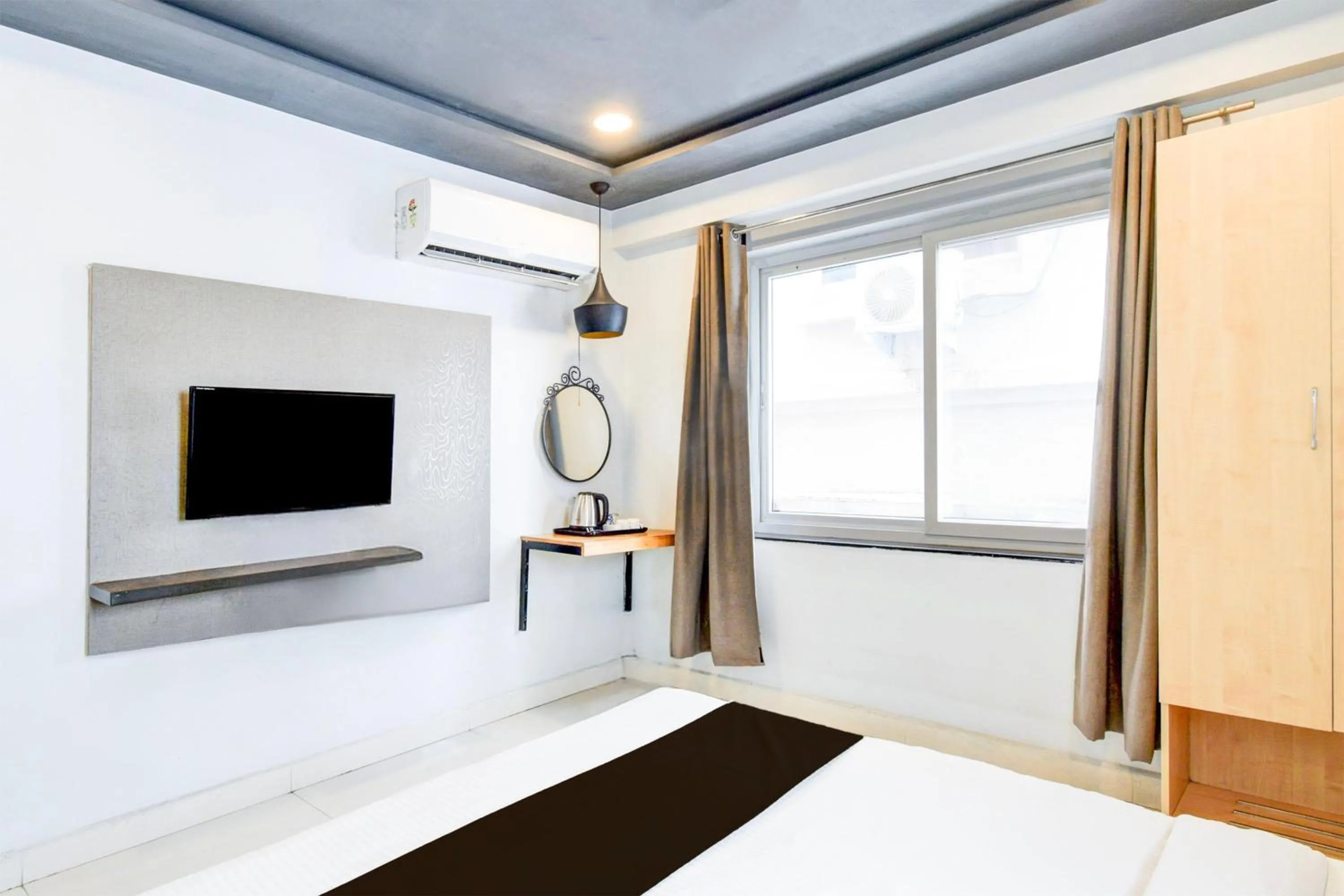 Bedroom, Bed in Super Townhouse Hi Tech City Hyderabad