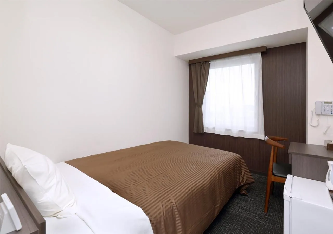Photo of the whole room, Bed in Hotel Trend Okayama Ekimae