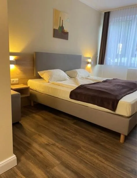 Bed in Hotel Harmshof Bispingen